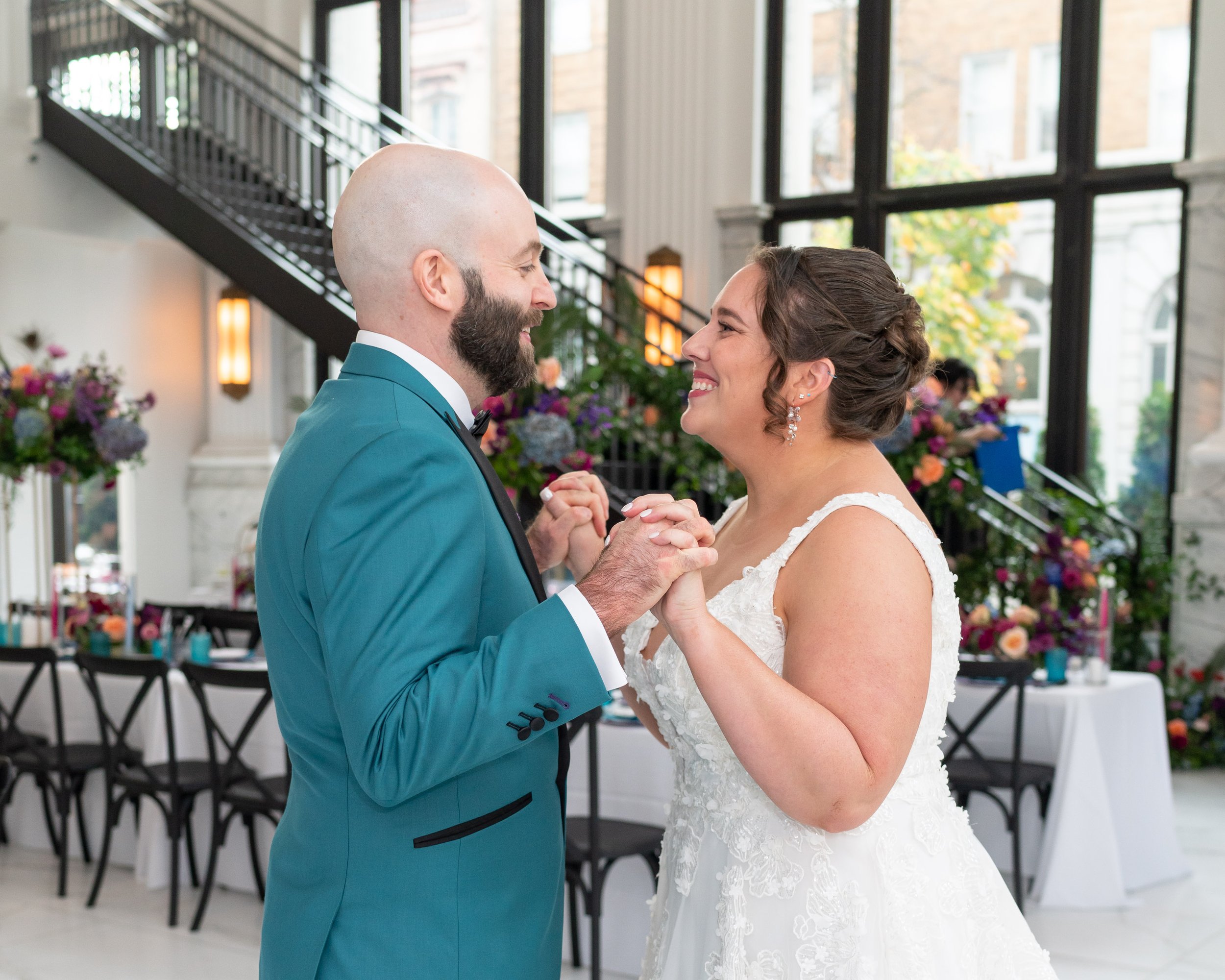 Bride and groom smiling at each other at Citizen's Ballroom