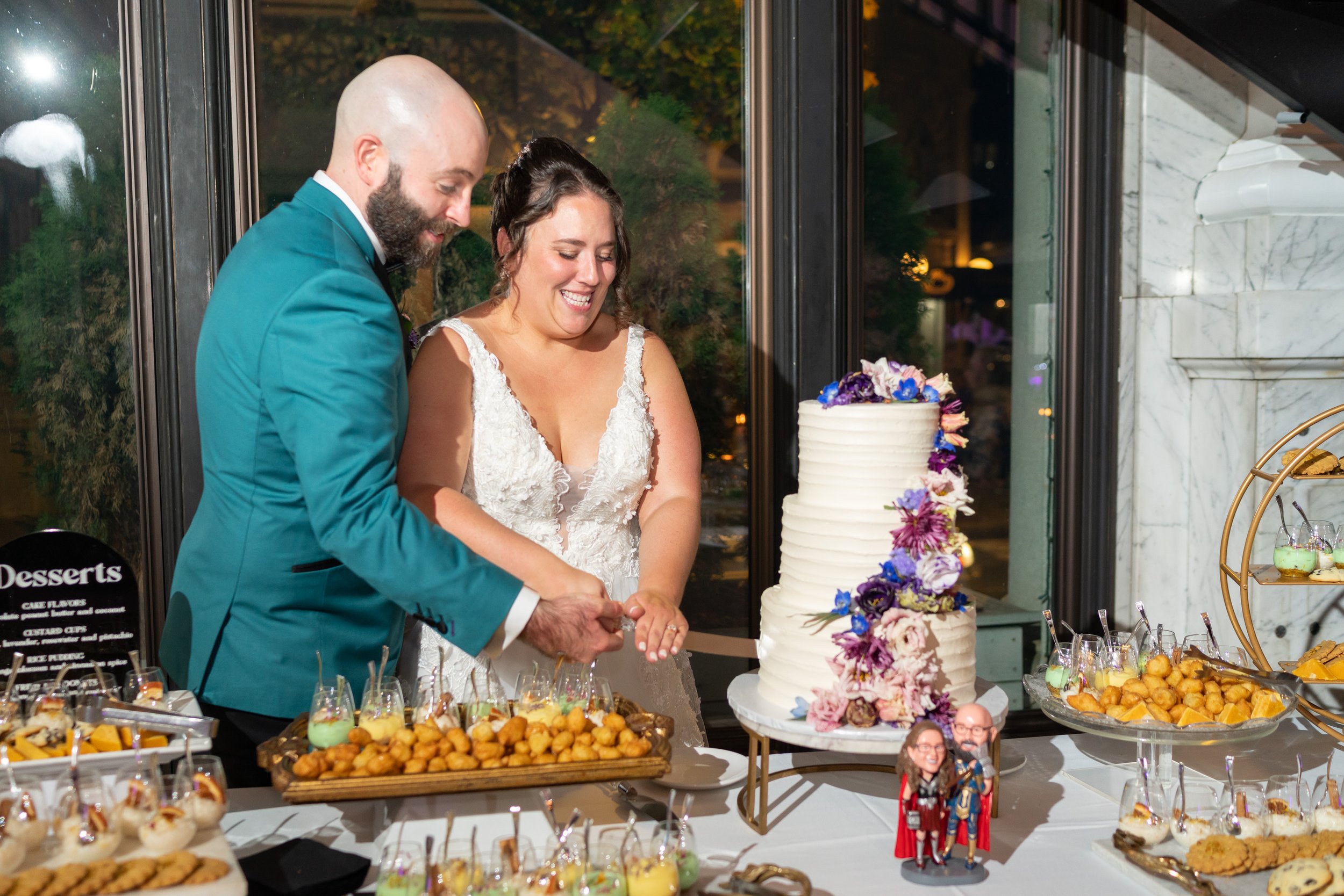 Bride and groom cut Bakehouse wedding cake in Frederick maryland