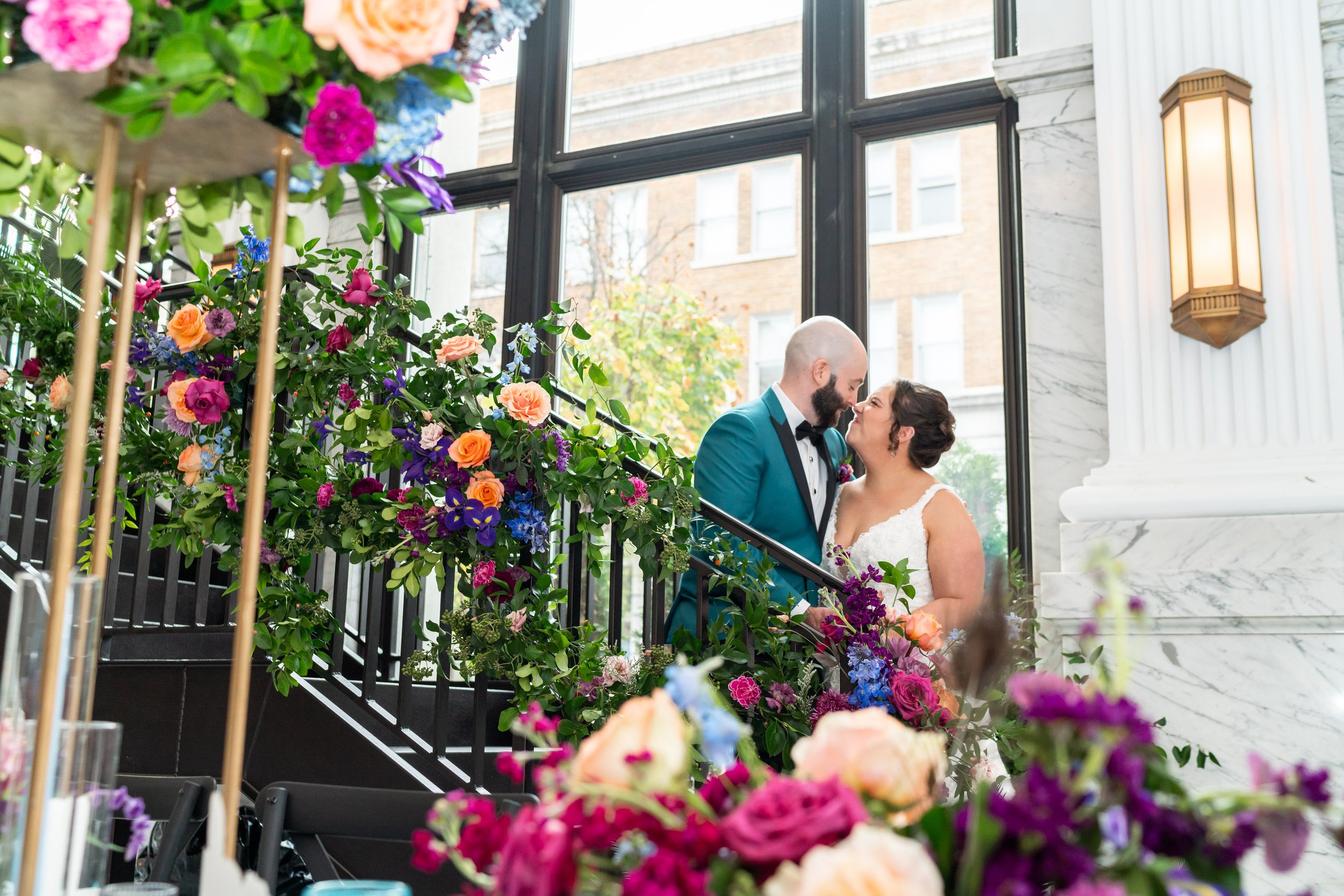 Floral staircase and wedding reception at citizens ballroom bank