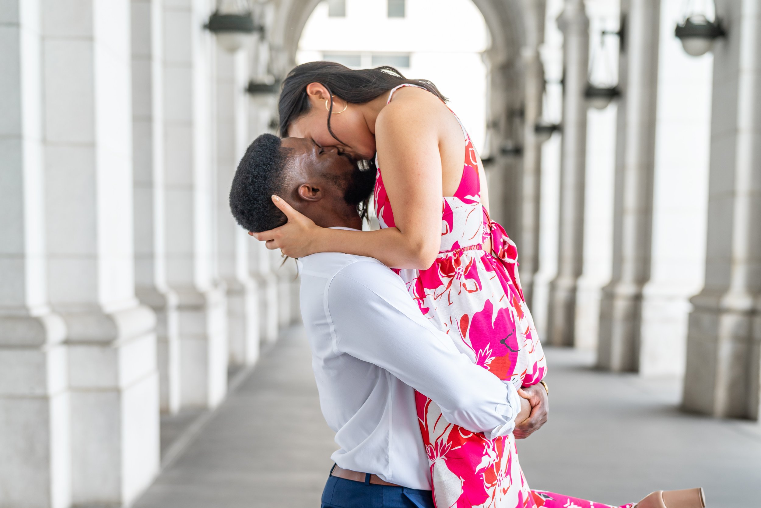 Groom lifts bride and kisses at dc union station