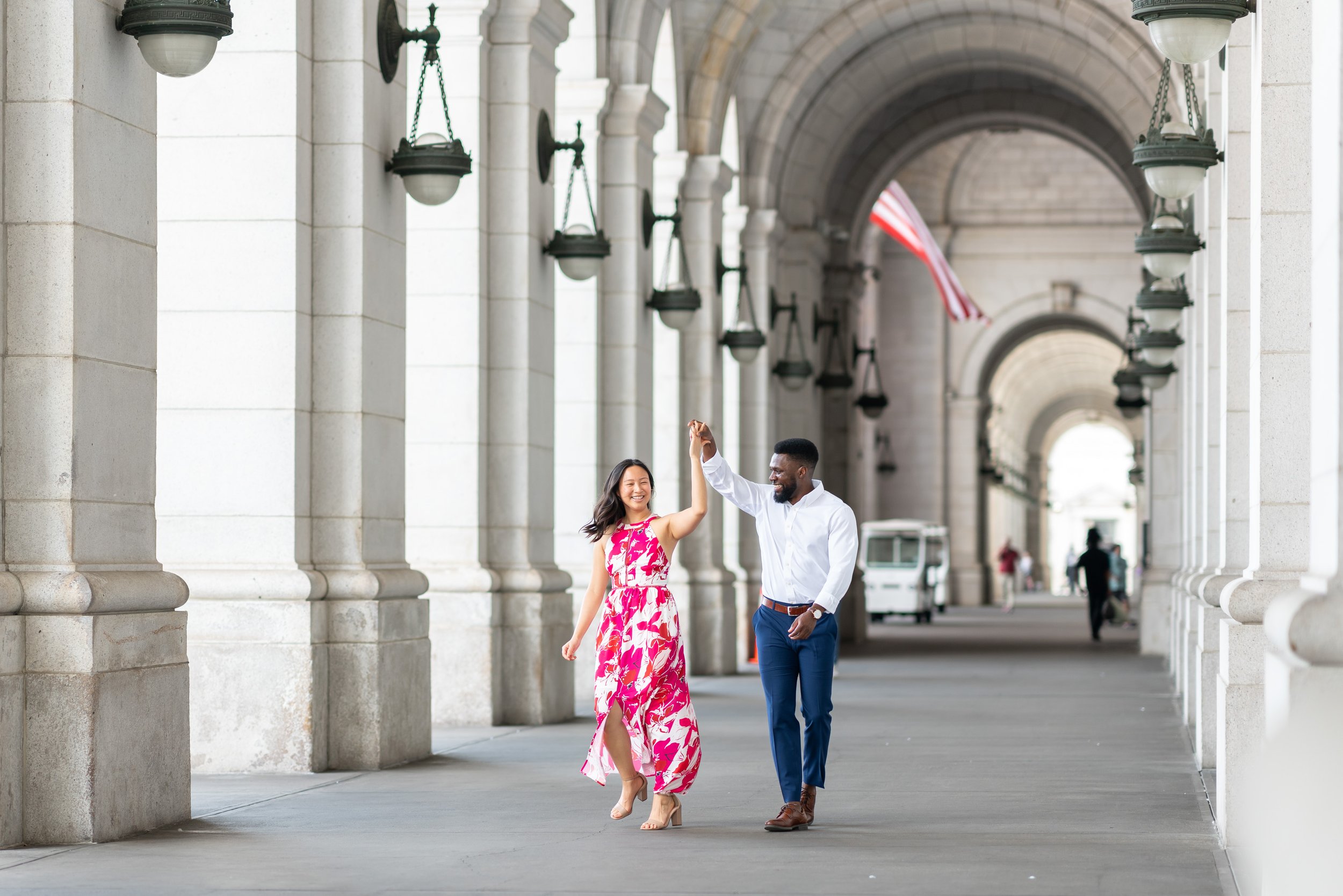 Couple dances at DC union station for engagement session