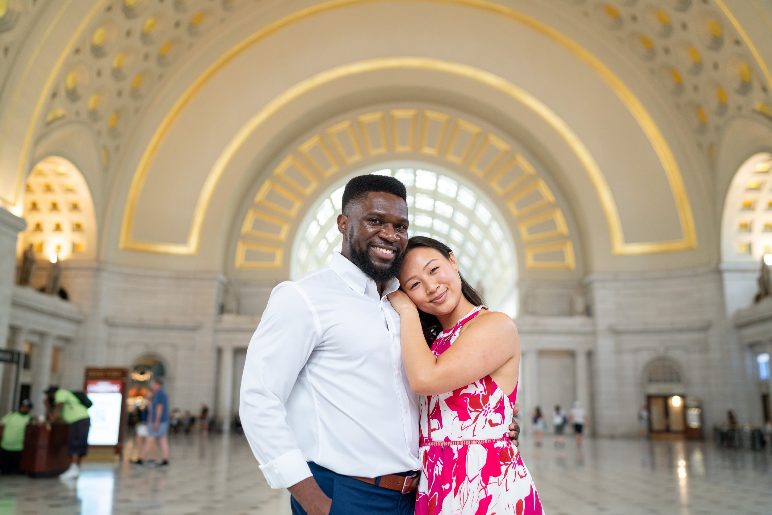 Bride and groom at Union Station inside under the gold arches