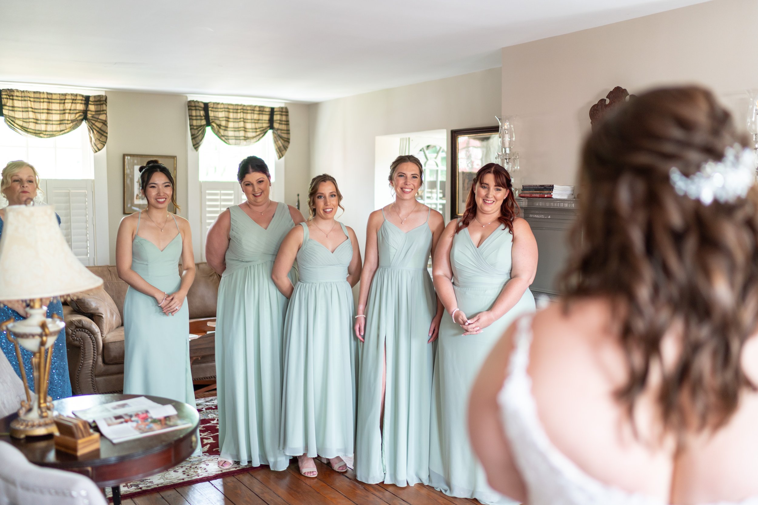 Bride and bridesmaids doing bridesmaid first look