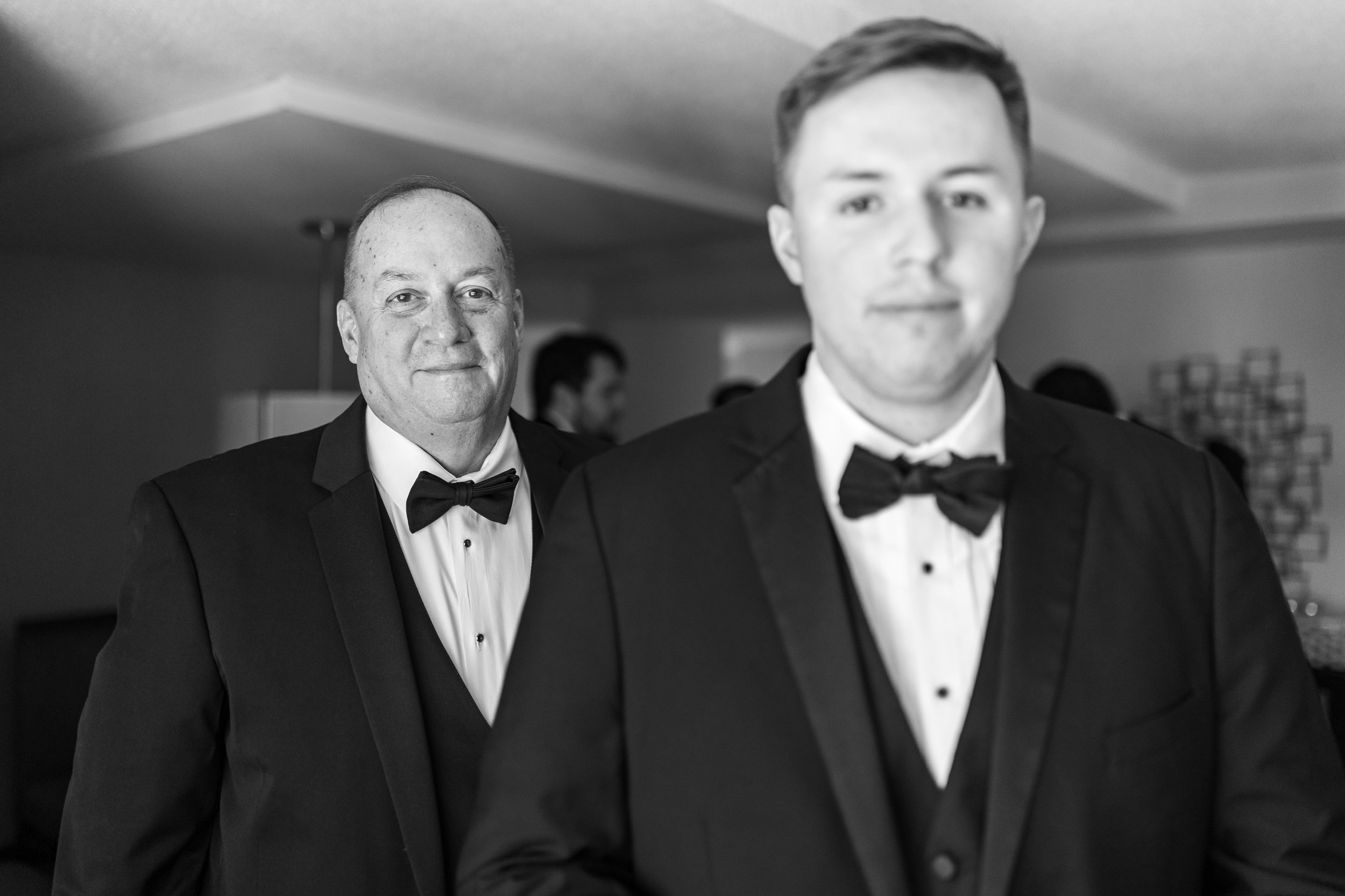 Classic film luxury groom and father during the getting ready photos
