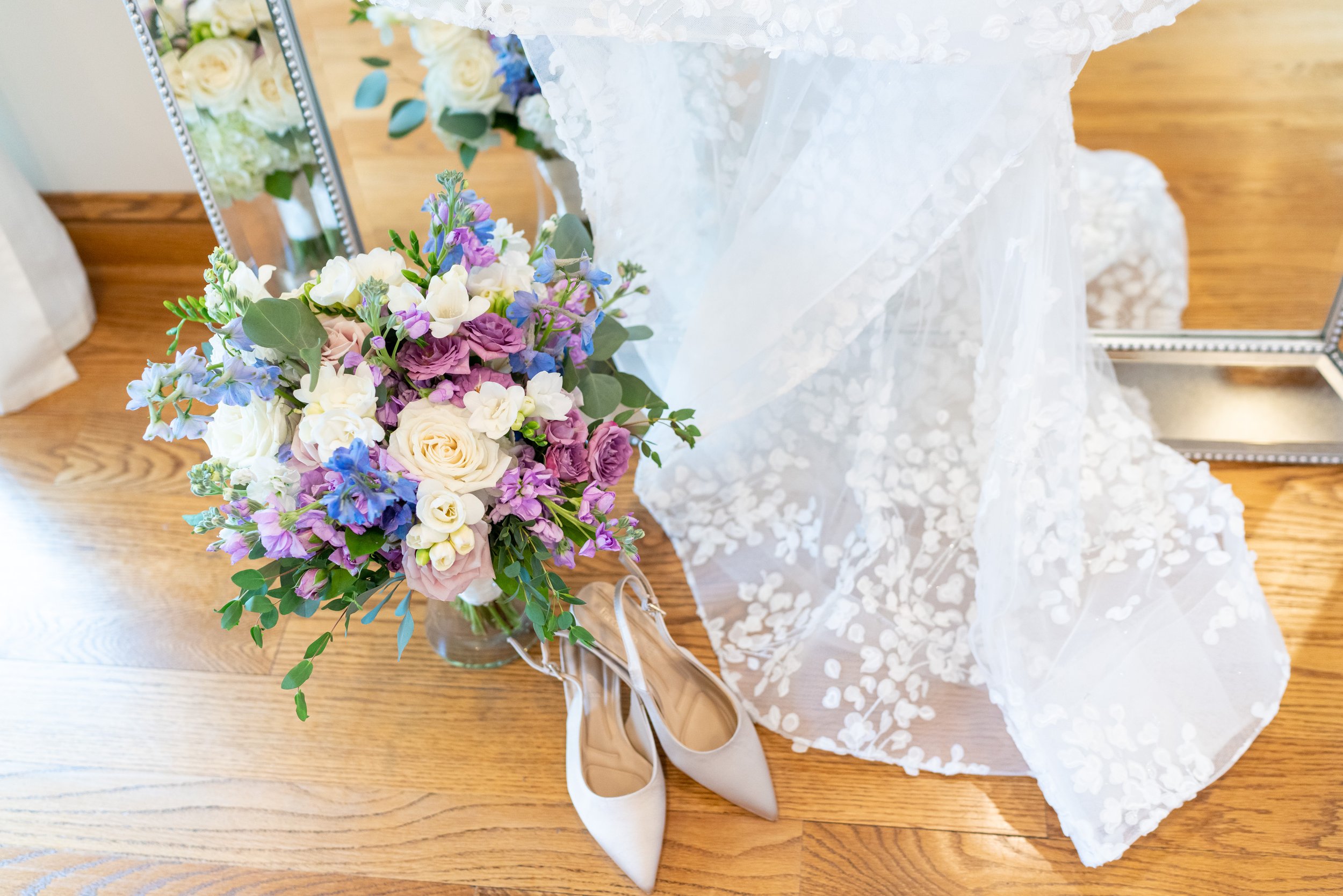 wedding dress train with flowers and modern shoes