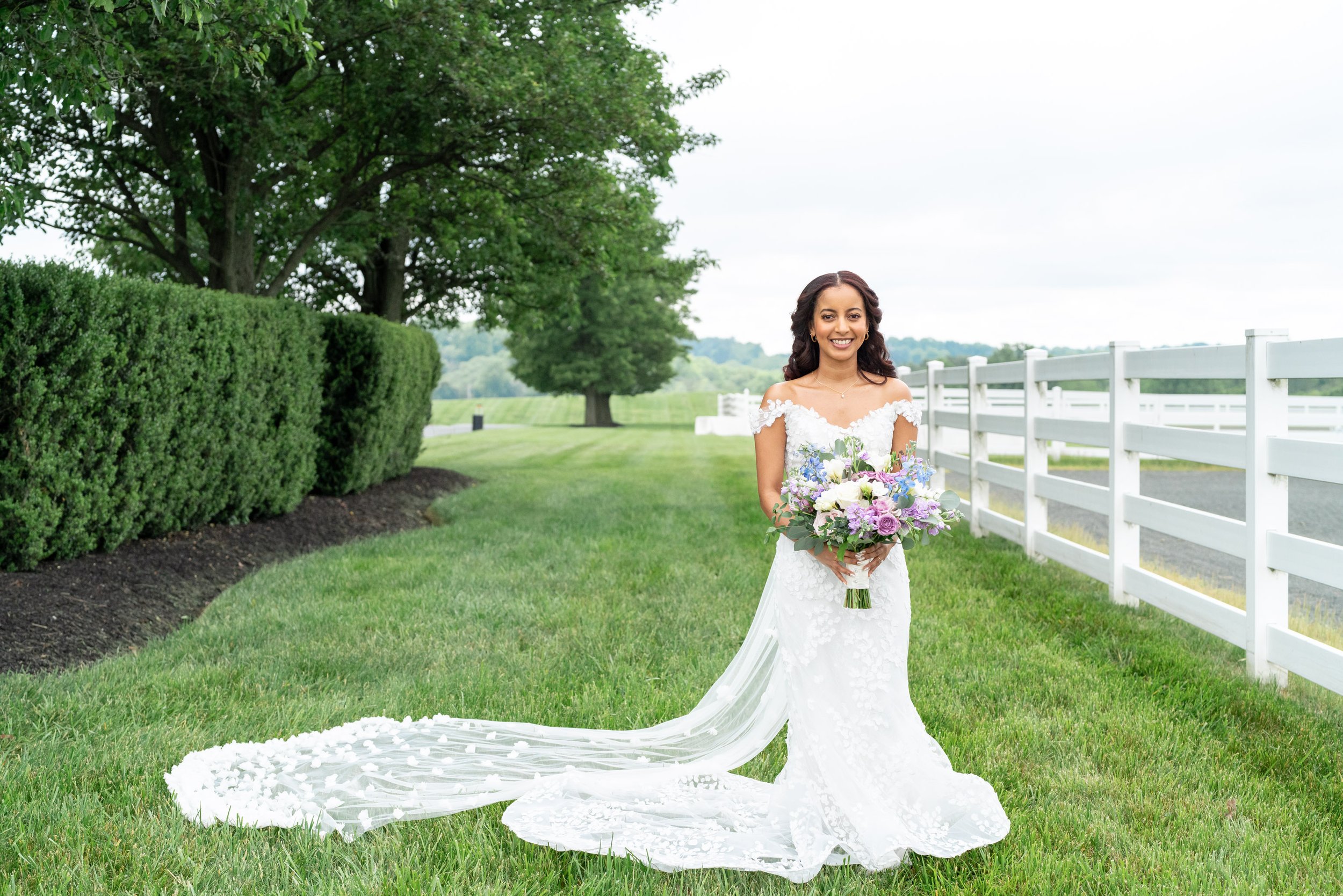 Bride portrait with purple bouquet at horse farm Vignon manor farm wedding