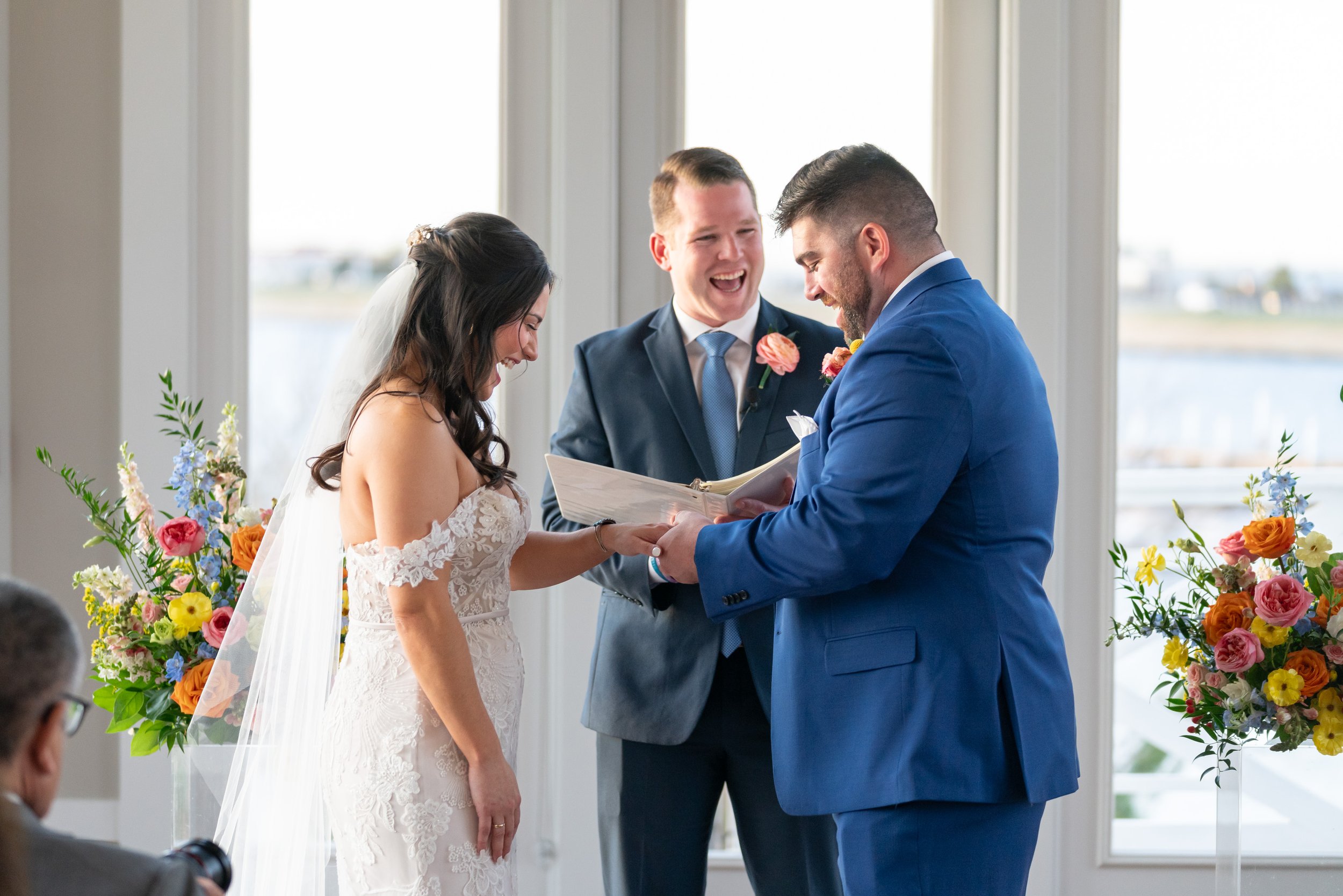 Bride and groom rings and vows at Chesapeake Bay Beach Club in the fall