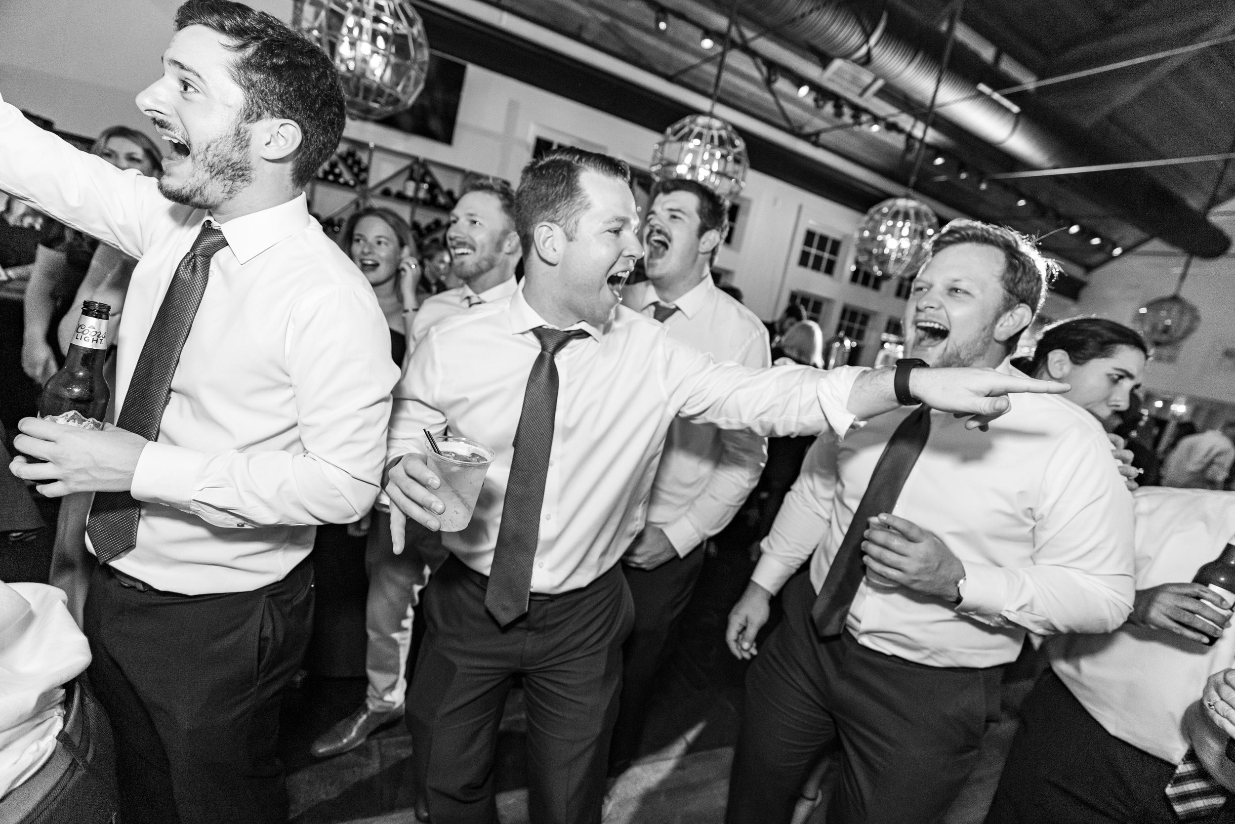 groomsmen laughing and dancing on the dance floor at Chesapeake Bay Beach Club wedding