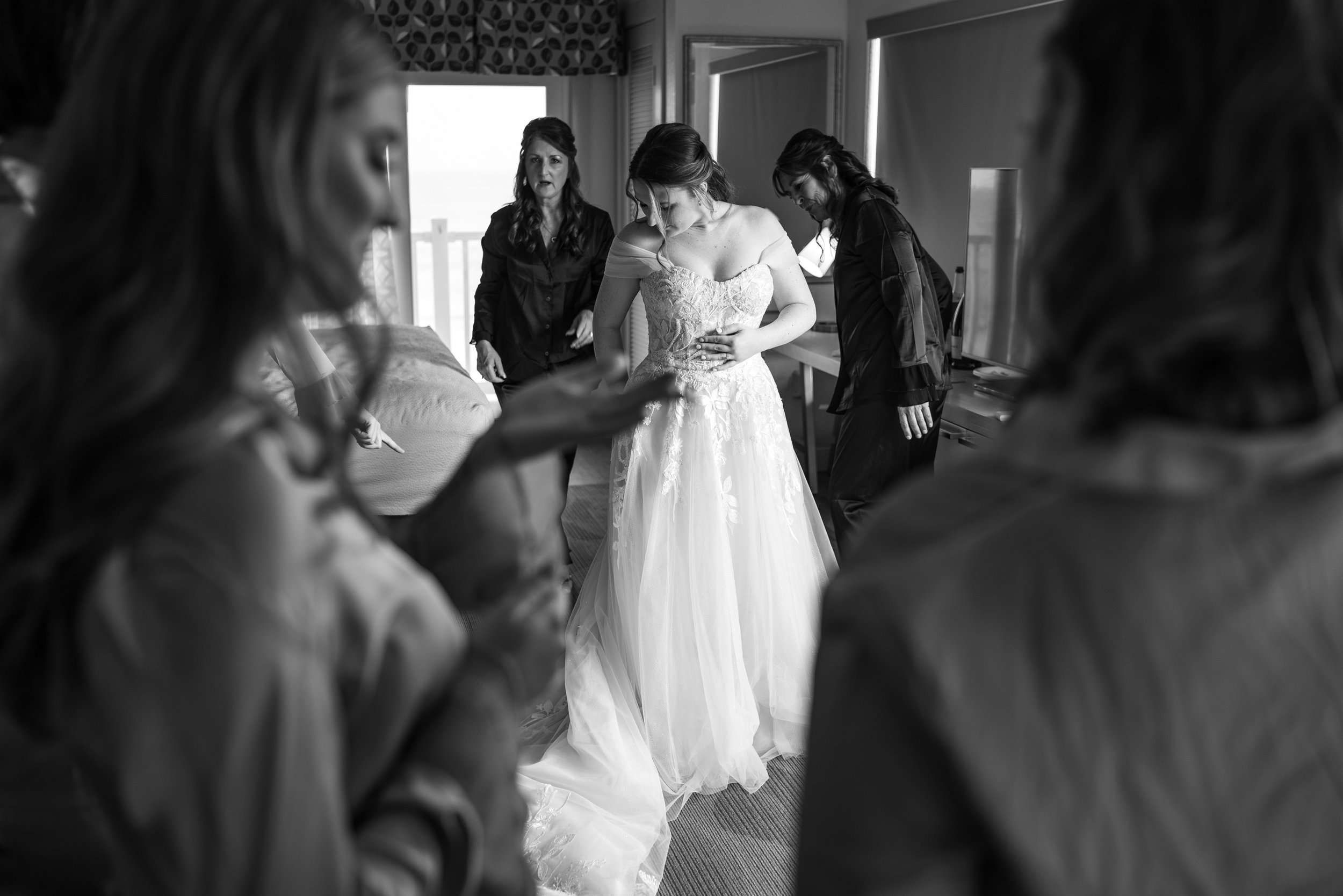 Bridesmaids watching bride at Hilton Garden Inn Outer Banks wedding