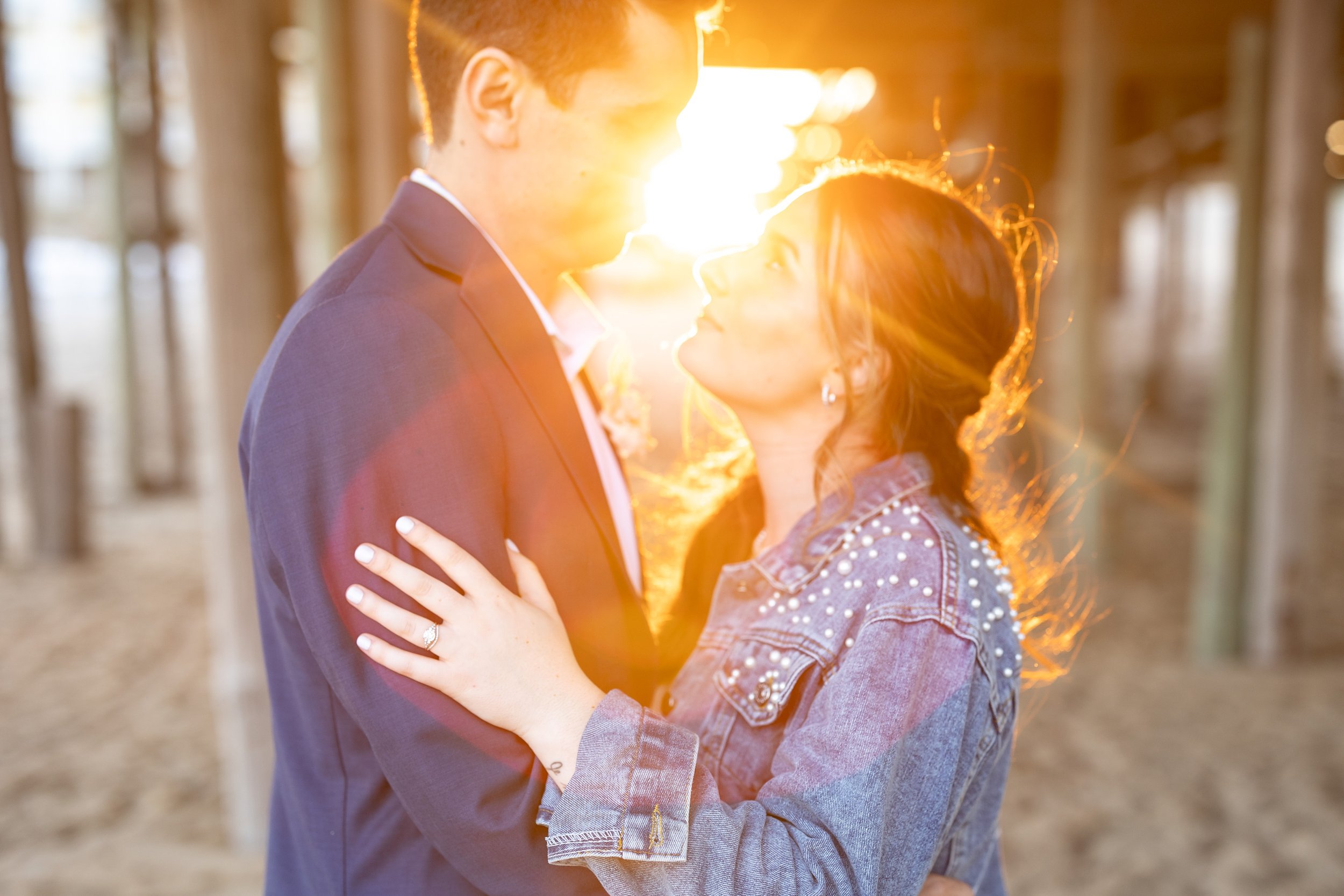 Wedding photos at sunset under the kitty hawk pier outer banks nc