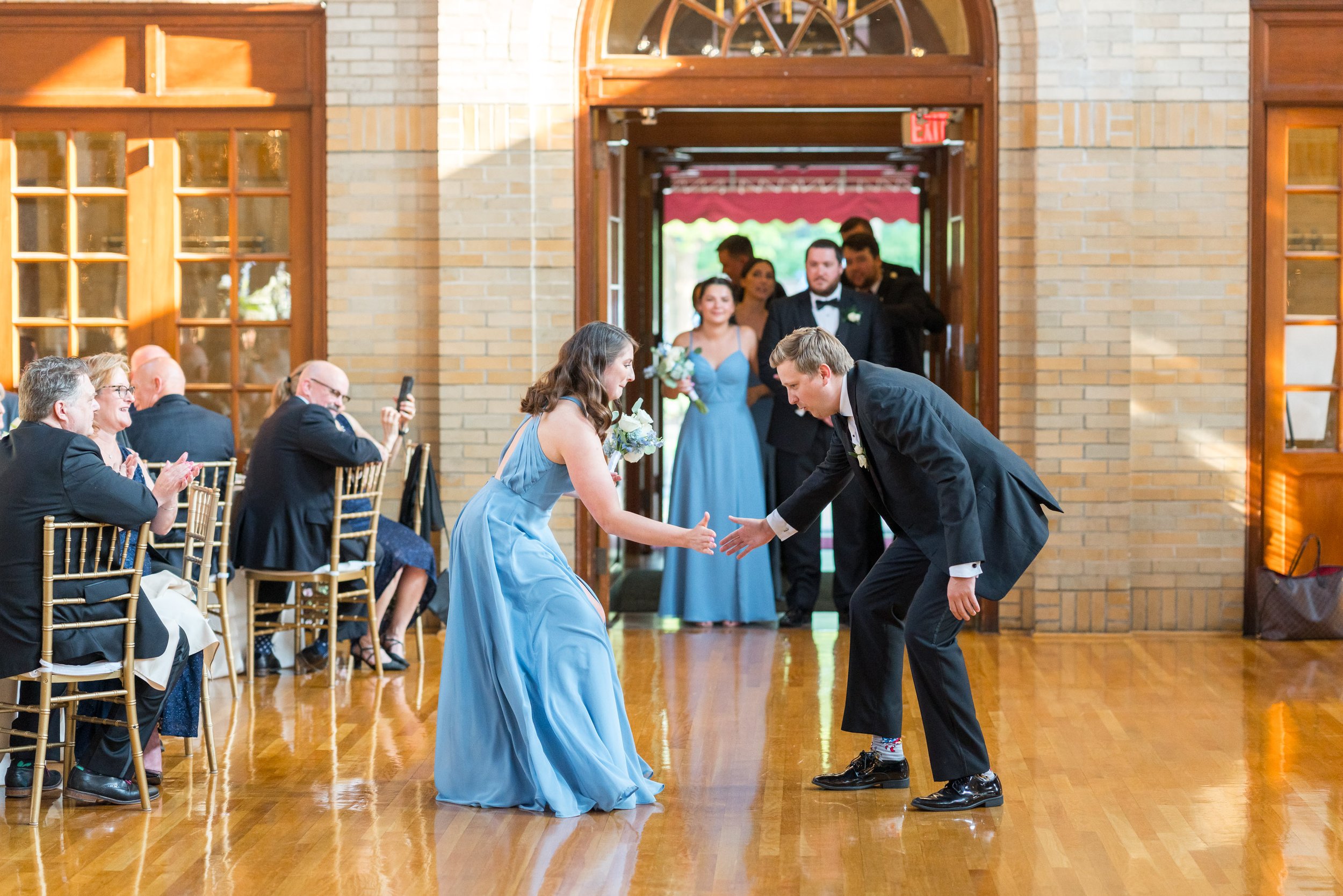 Fun bridesmaids in blue and groomsmen grand entrances fun and candid
