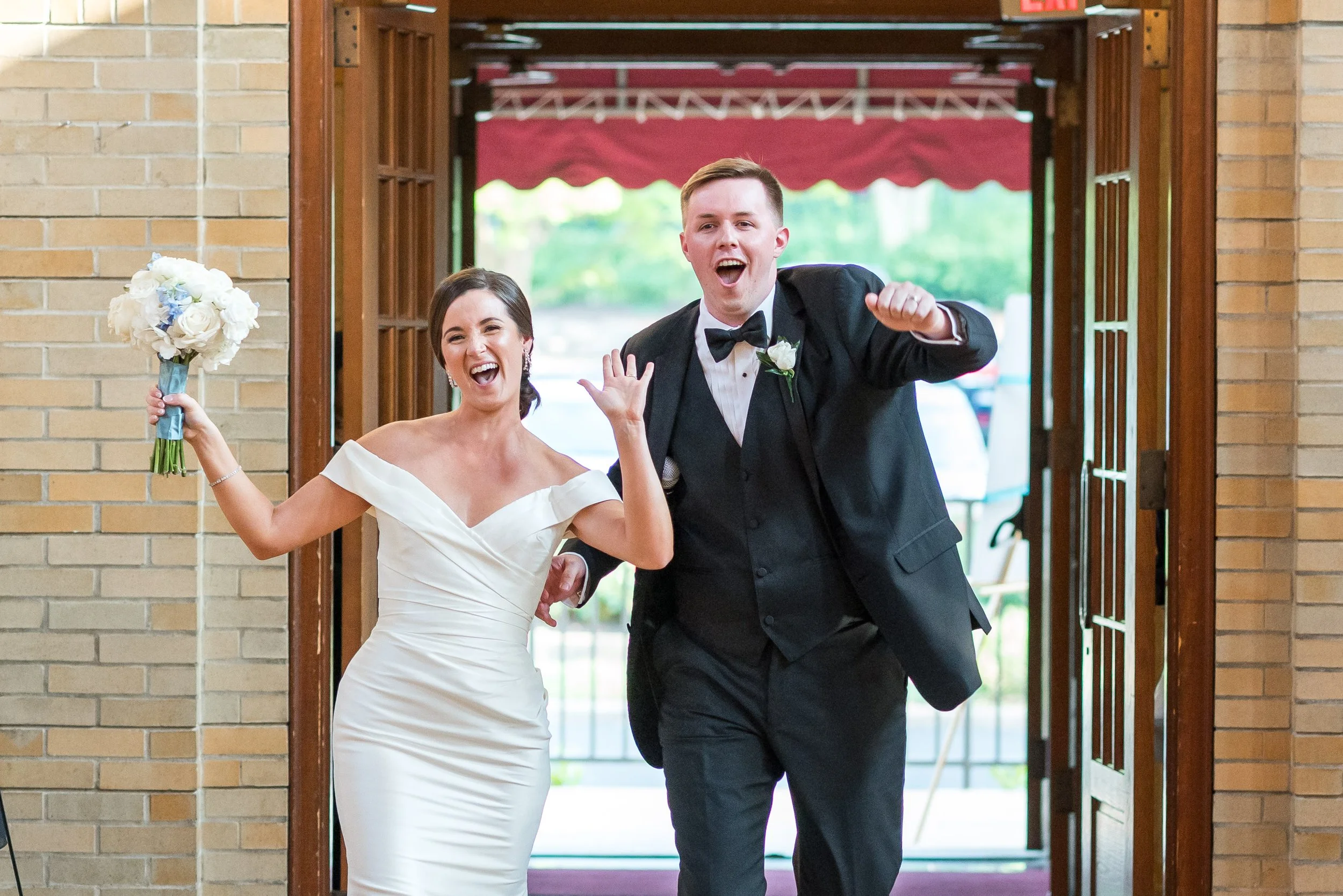 Bride and groom couple's grand entrance at St Francis reception hall