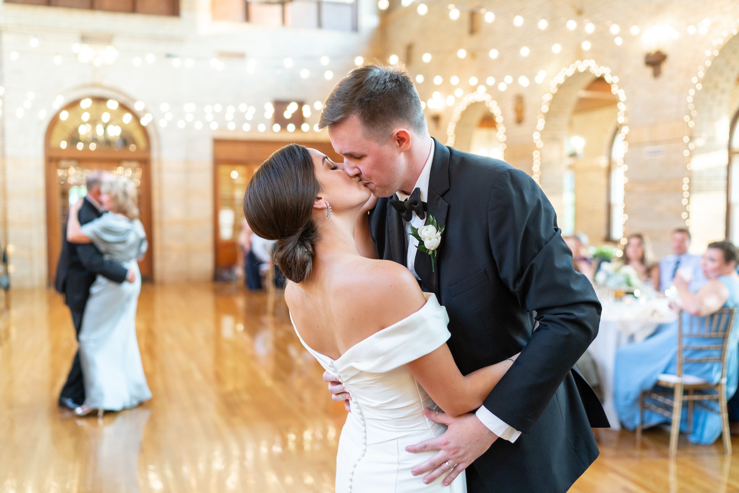 Bride and groom share first dance with their parents at fun wedding St Francis Hall