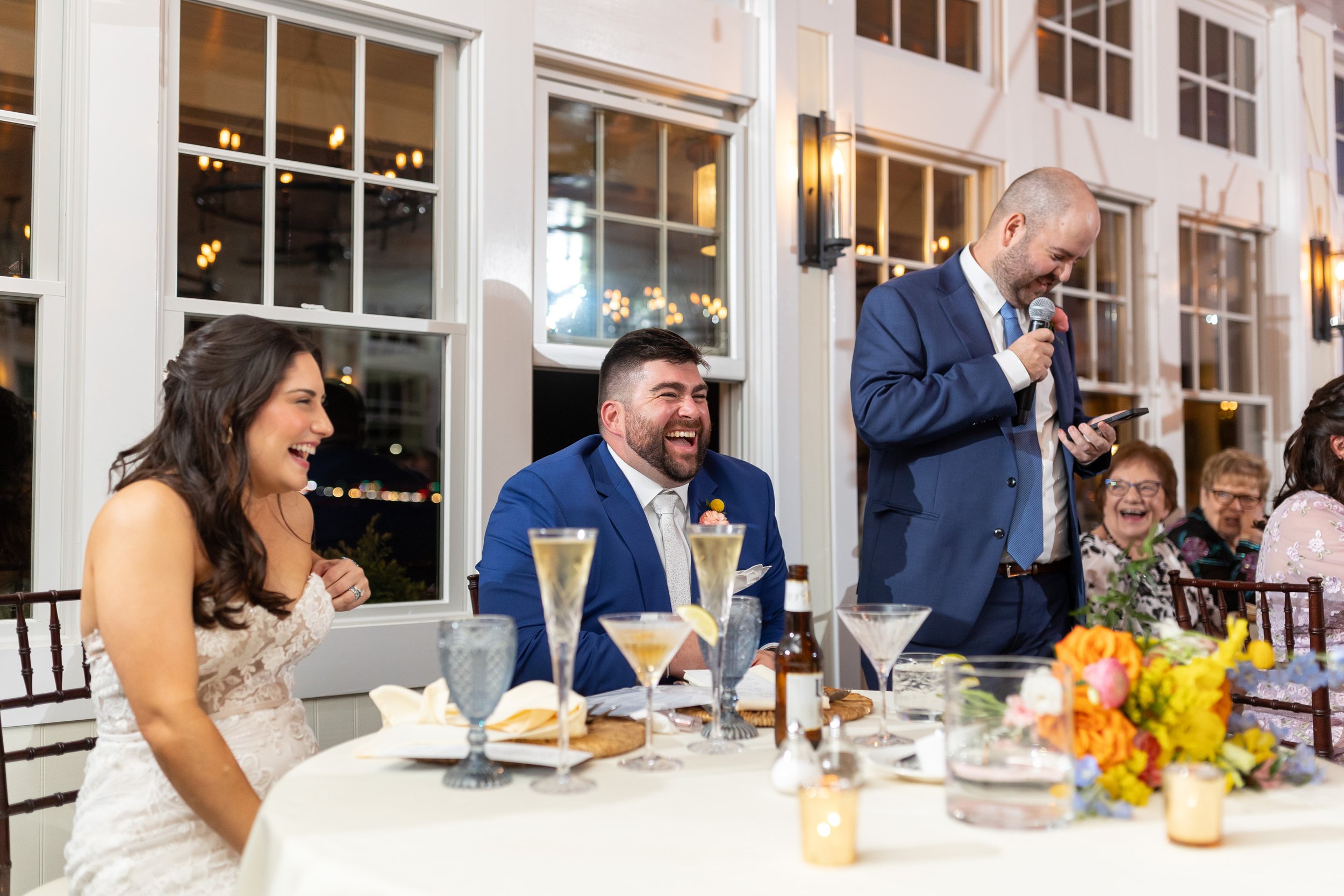Best man giving toast at beach wedding in Annapolis maryland