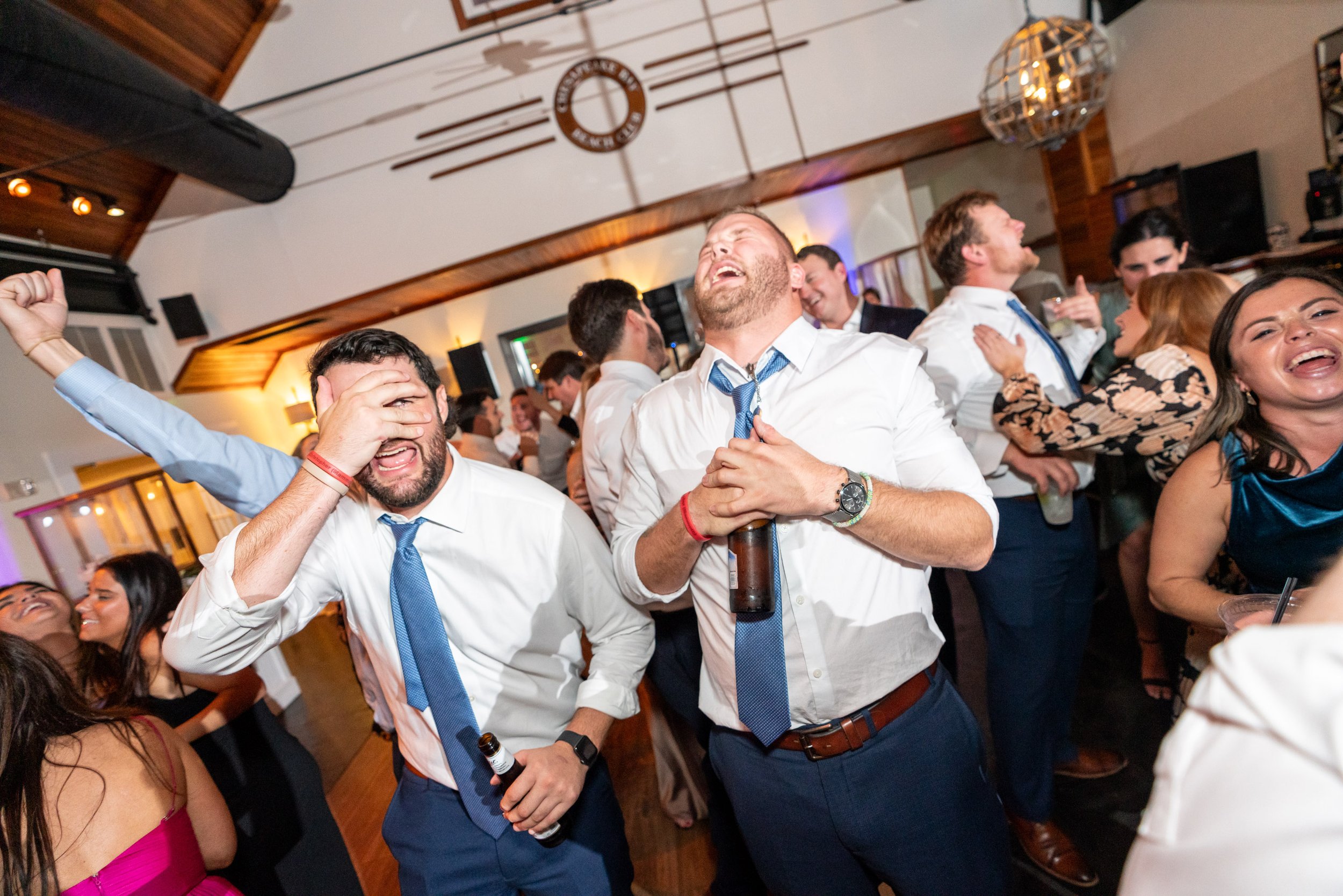 Groomsmen acting funny on the dance floor at maryland fun wedding photographer