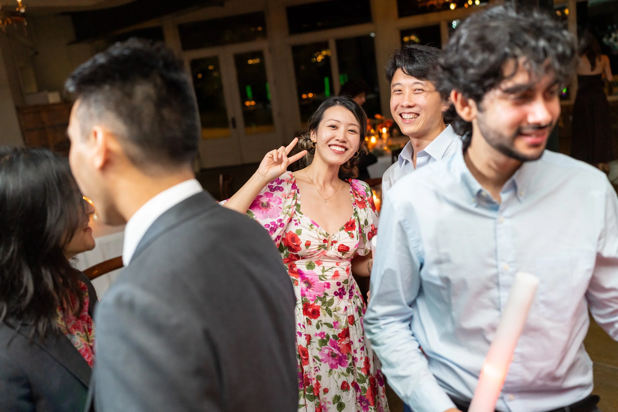 Wedding guests dancing at fun colorful candid wedding photography at Stone Tower
