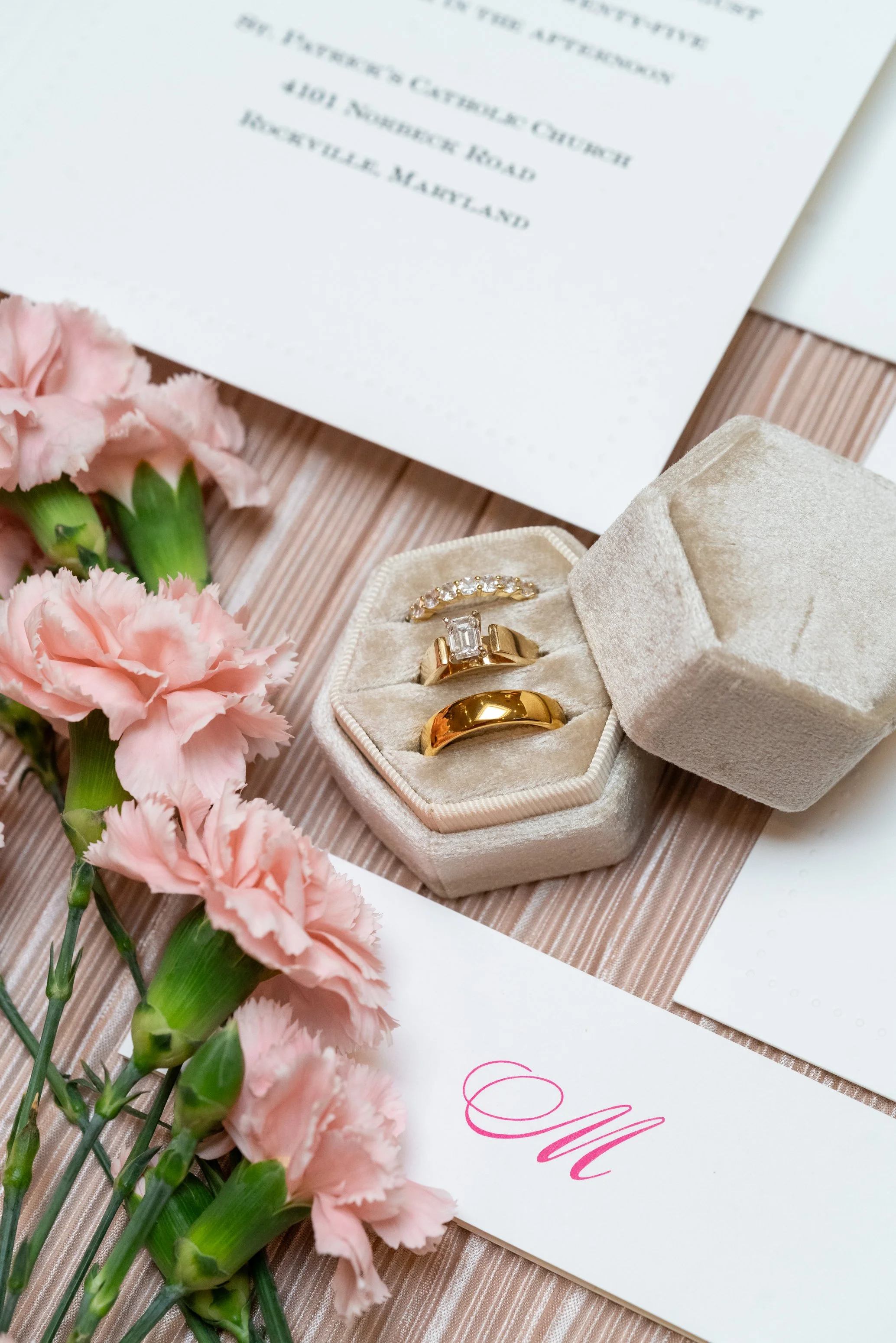 Classic flat lay wedding details in champagne and pink