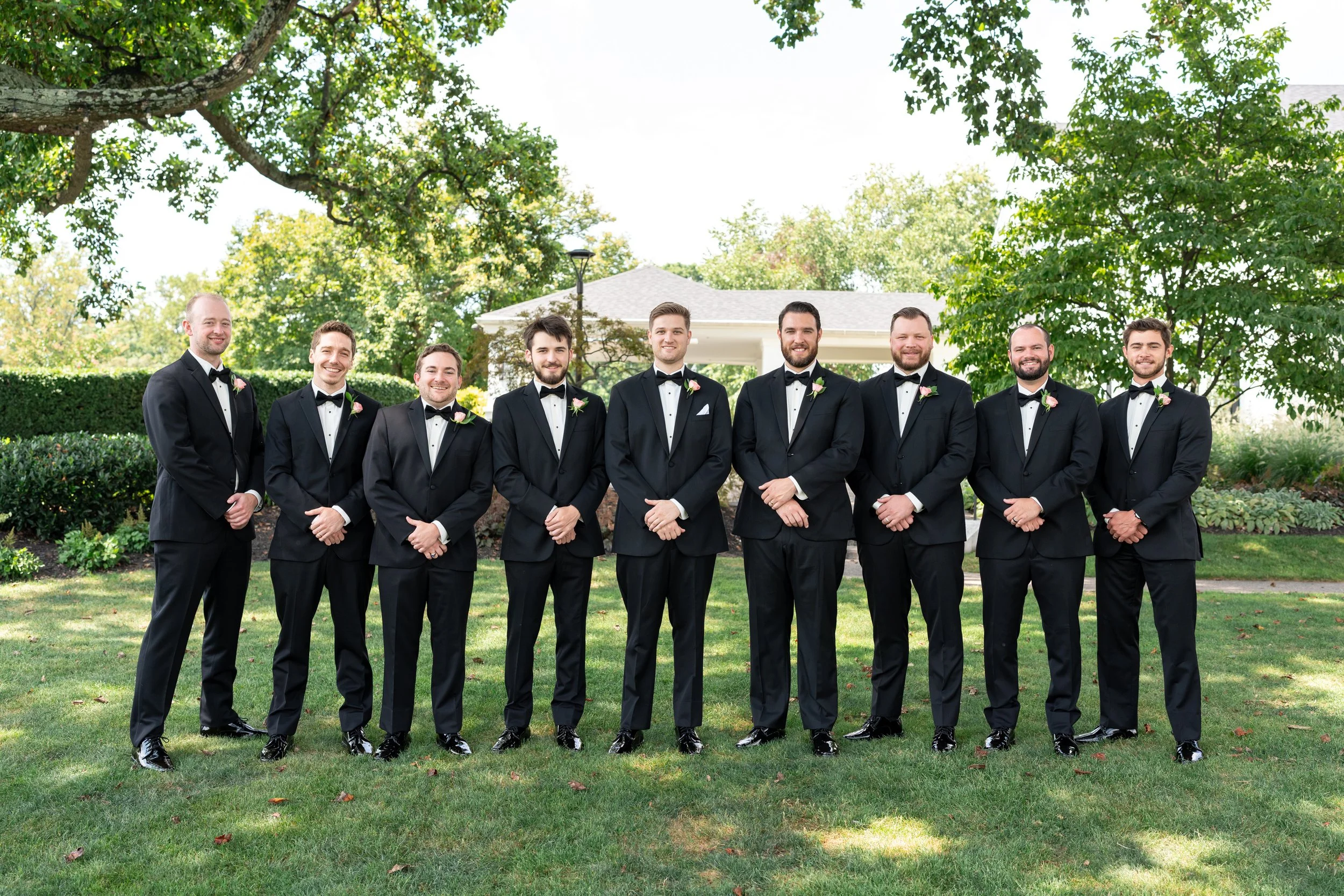 Groomsmen posing with the groom at Manor Country Club wedding