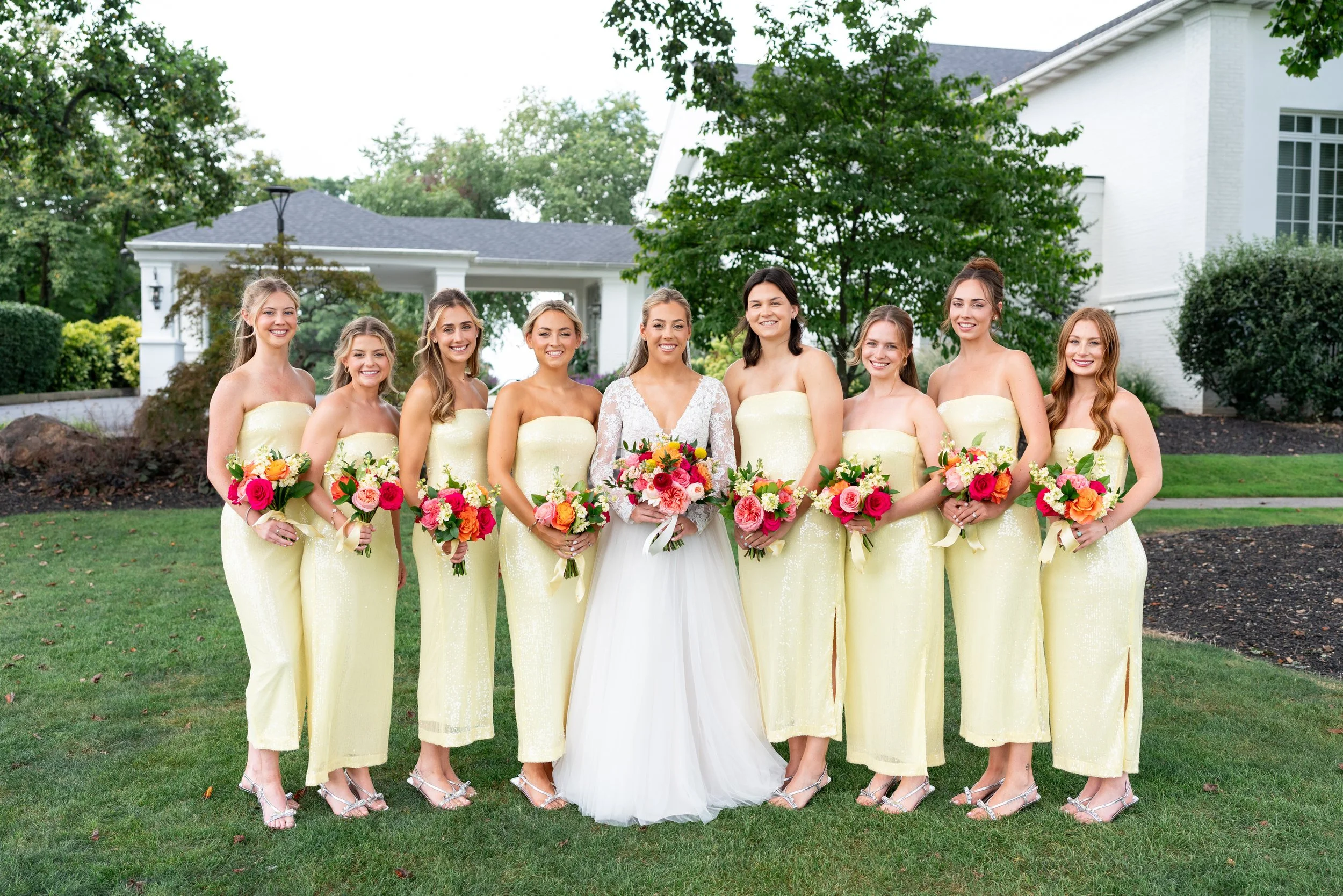 Bride and bridesmaids in yellow sequin dresses at Manor Country Club wedding