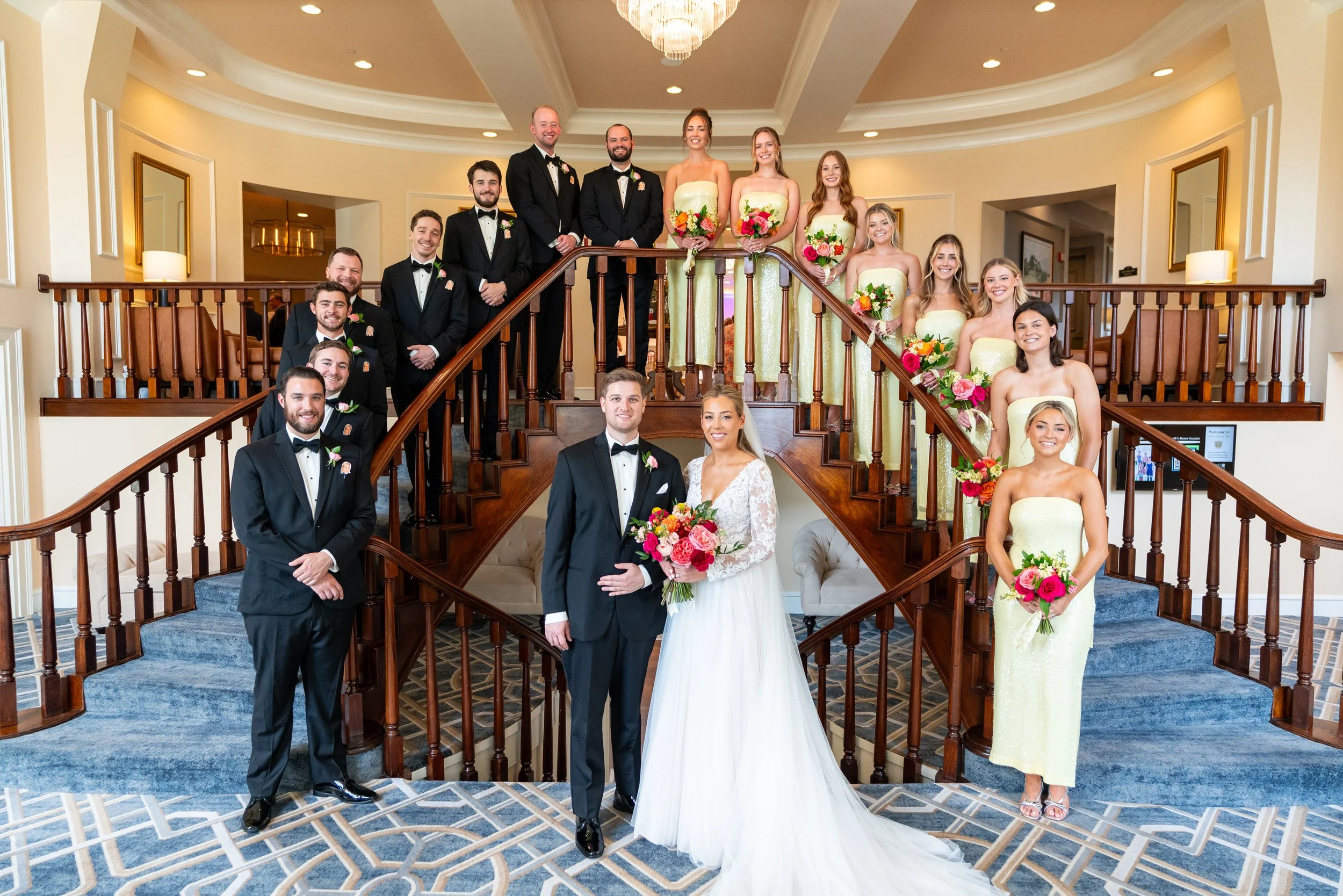 Bride groom and wedding party on the stairs at Manor Country Club wedding photos