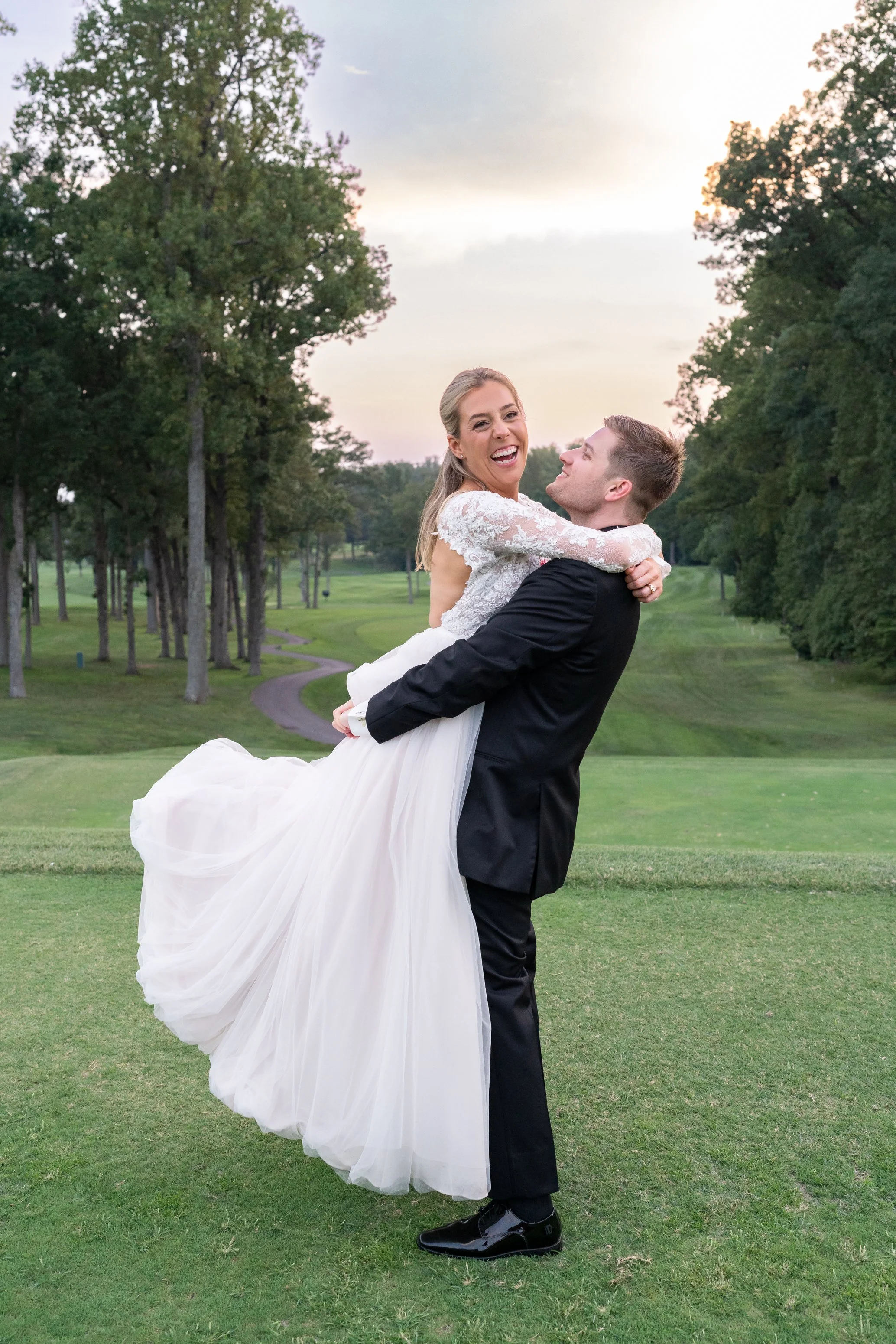 bride and groom sunset golden hour portrait at golf course Manor country club wedding