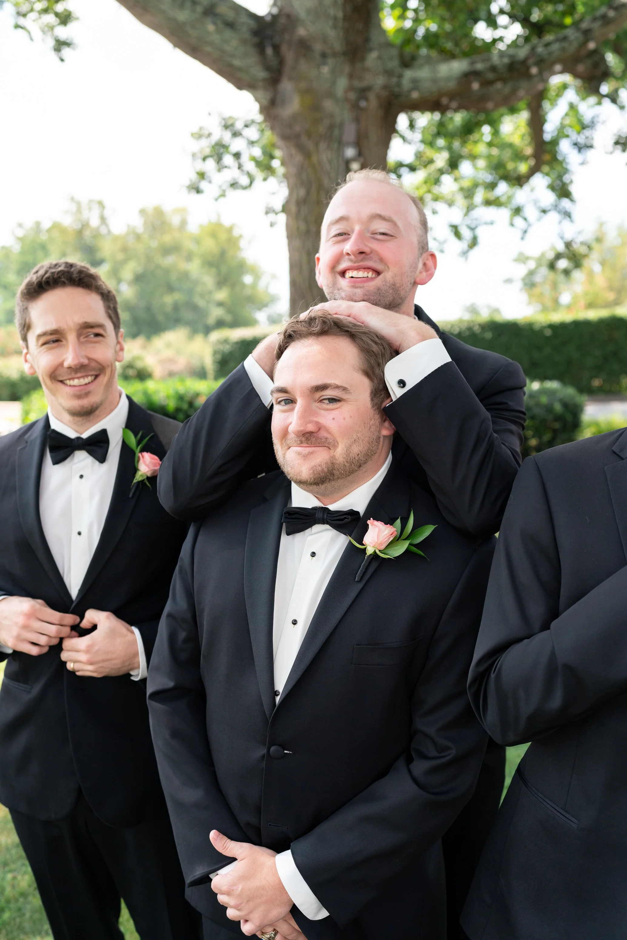groom getting ready photos at manor country club in rockville wedding