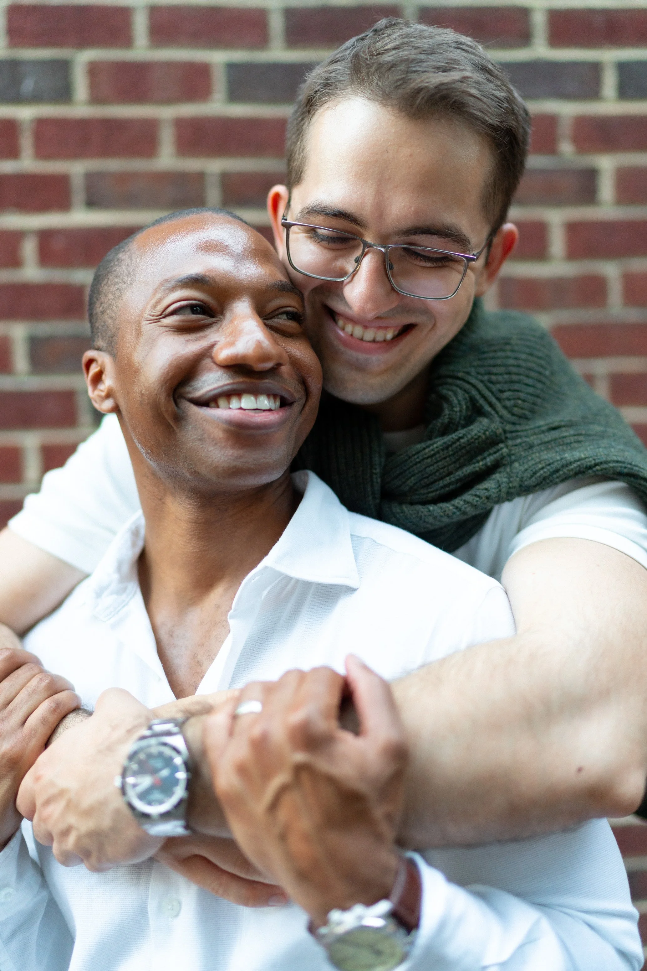 couple hugging for candid engagement photos in Georgetown dc