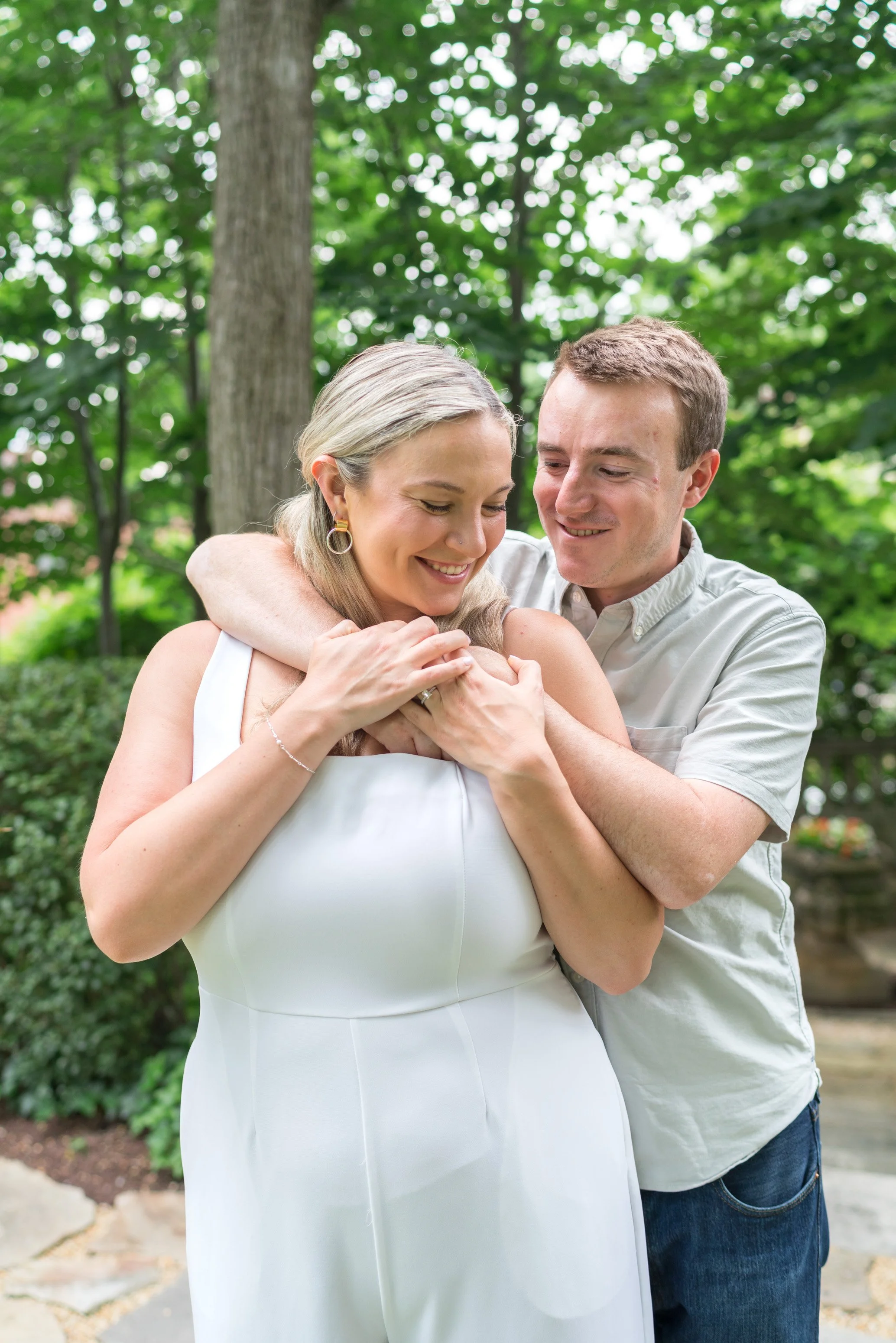 couple embrace at candid colorful engagement photos in Washington DC