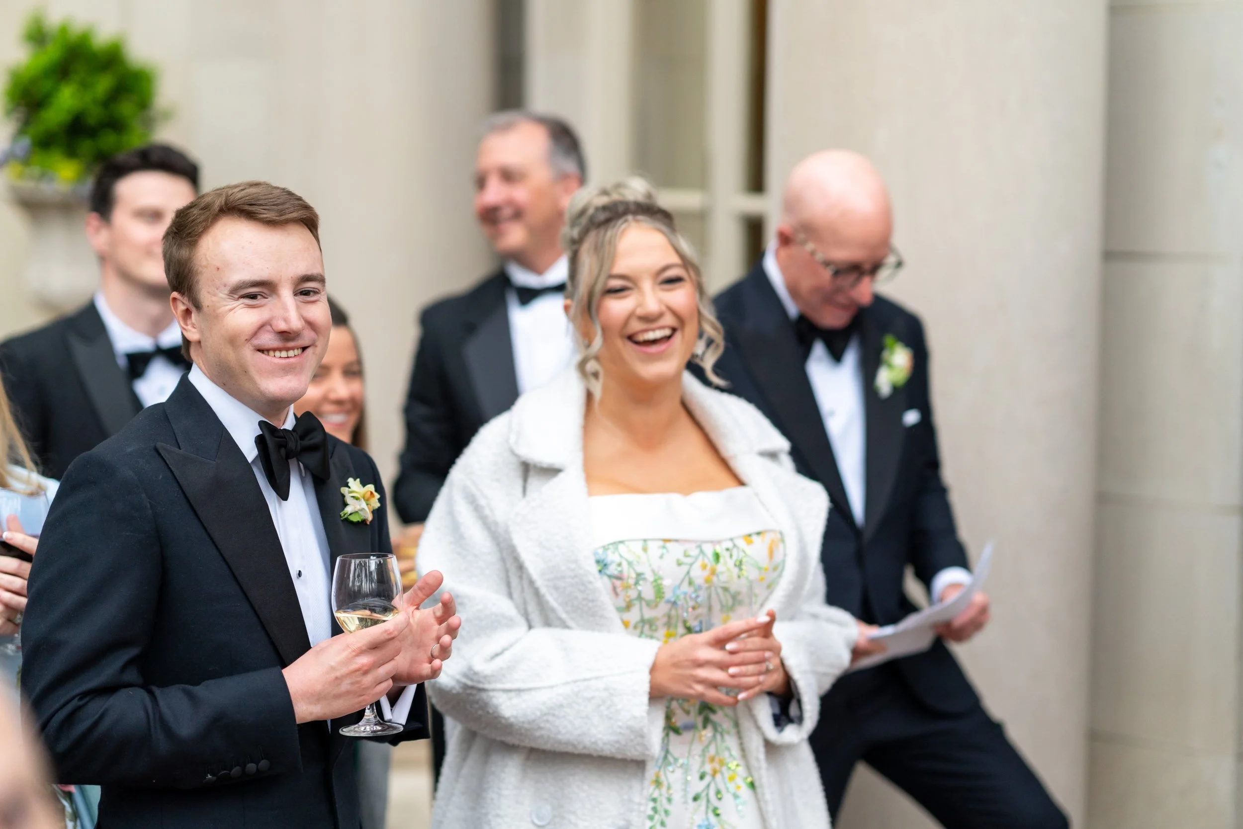 Bride and groom laughing at speeches at meridian house in dc