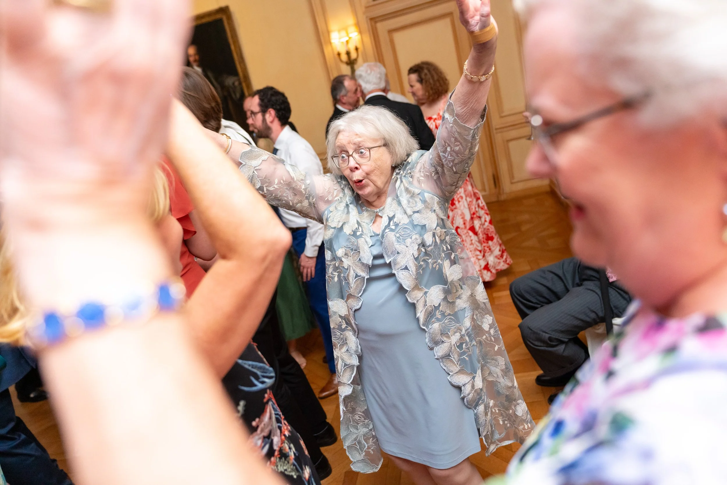 Funny happy grandma on the dance floor candid photography at Meridian House Wedding