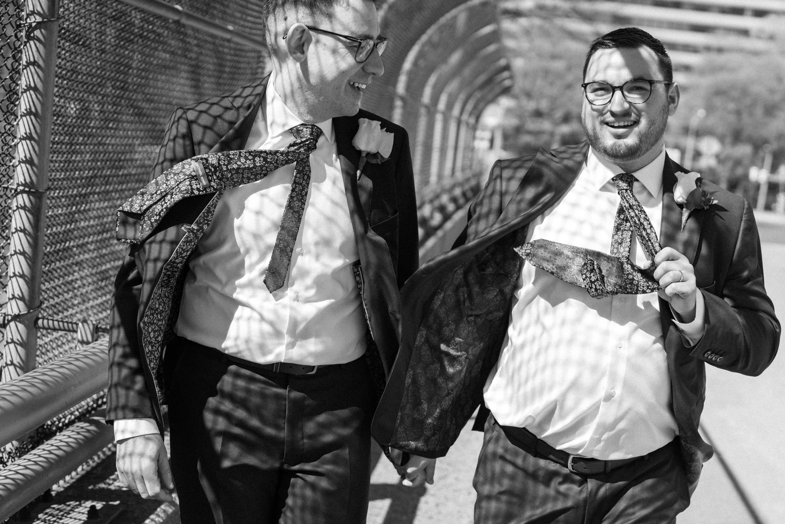Grooms in navy and burgundy suit portraits on wedding day gay wedding Washington dc