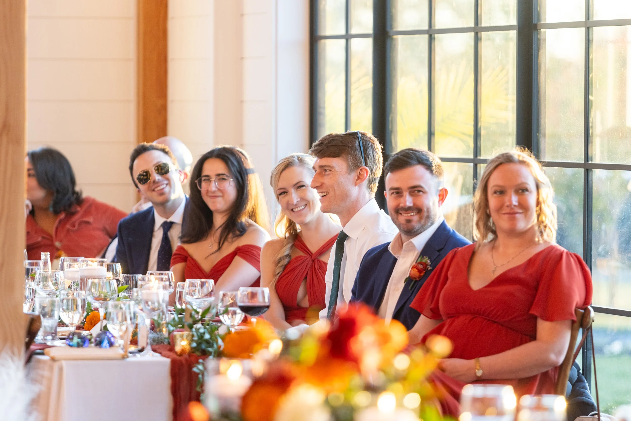 Beautiful bright colorful wedding photograph of the toasts and speeches at Hilltop Farm