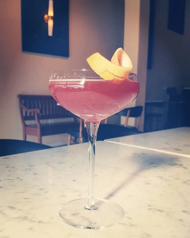 Crème de cassis and grapefruit play off each other brightly in this pretty, pink, fall drink. #sipgood #happyfriday #fromthebar #imbibe #craftcocktails #pickwenatchee #visitwenatchee #drinkitin #thesidecarlounge #pumpingoutmagic #seasonalcocktails #summercocktails #thewenatcheehotel #wenatcheevalley #imbibegram