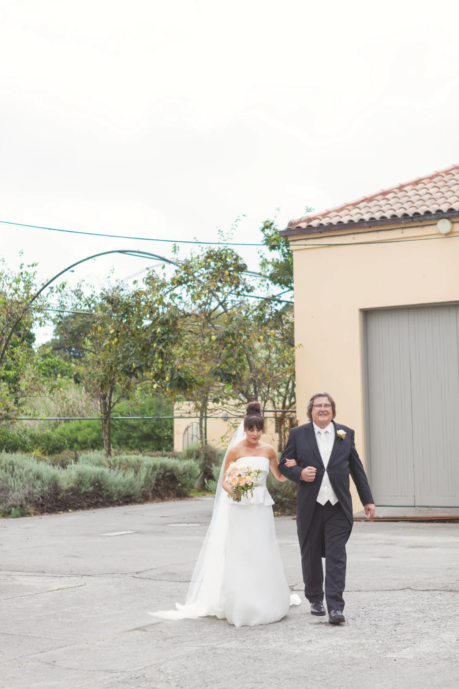 Bride walking down wedding aisle at The Milk Station