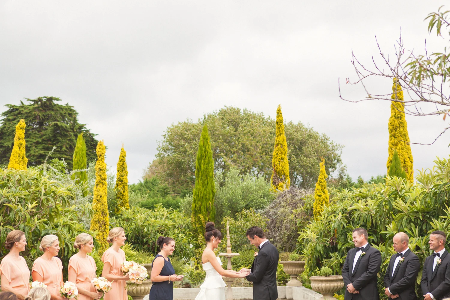 Bride and Groom exchanging wedding vows in garden wedding venue Wellington