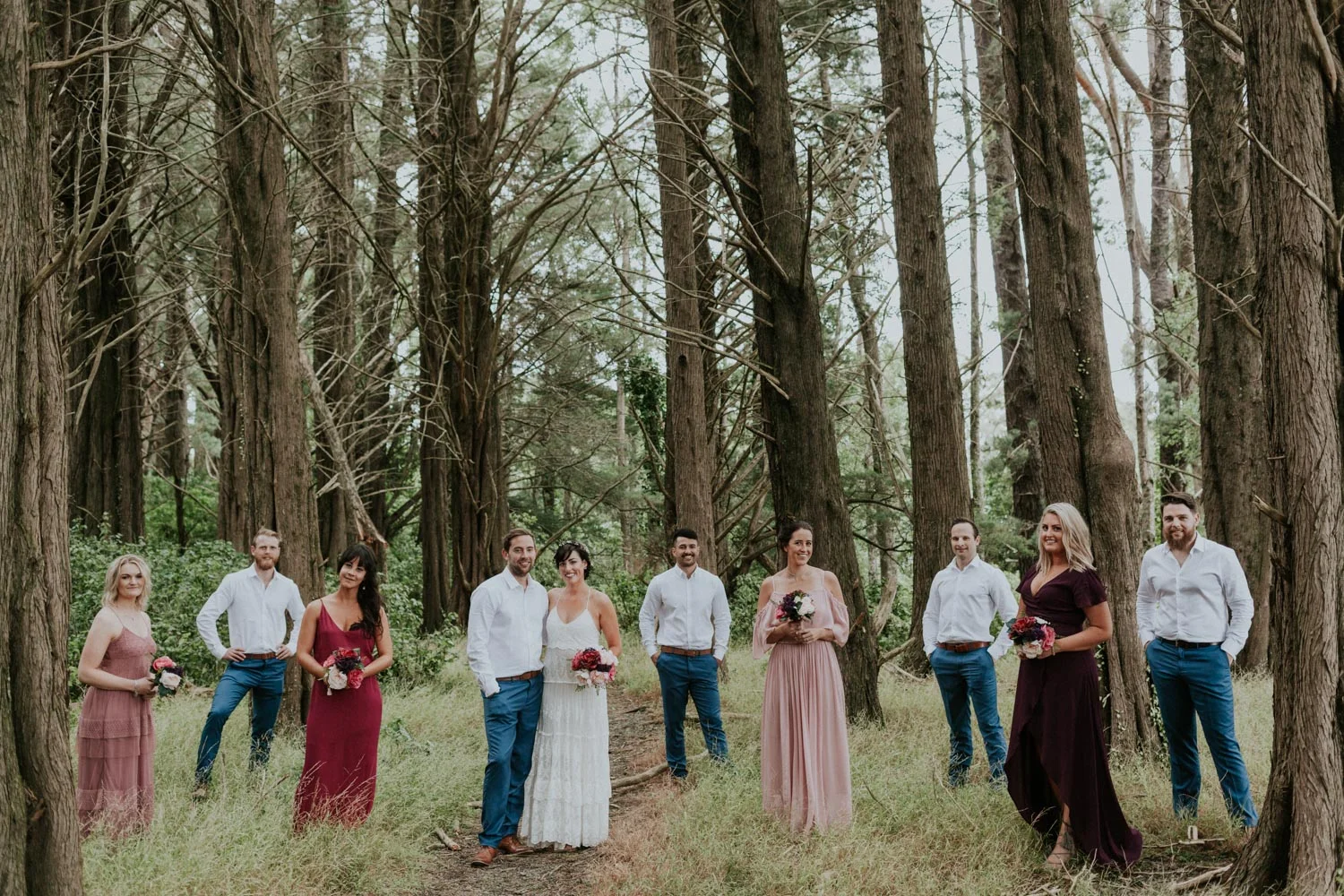 Bridal party photos in a pine forest