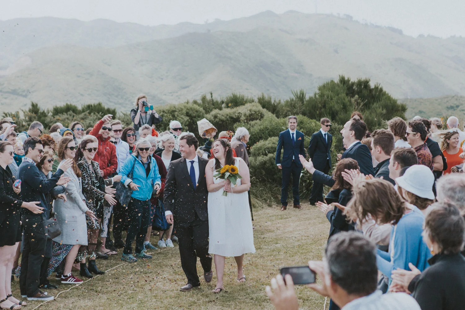 Groom walks his Bride down the wedding aisle during Wellington wedding