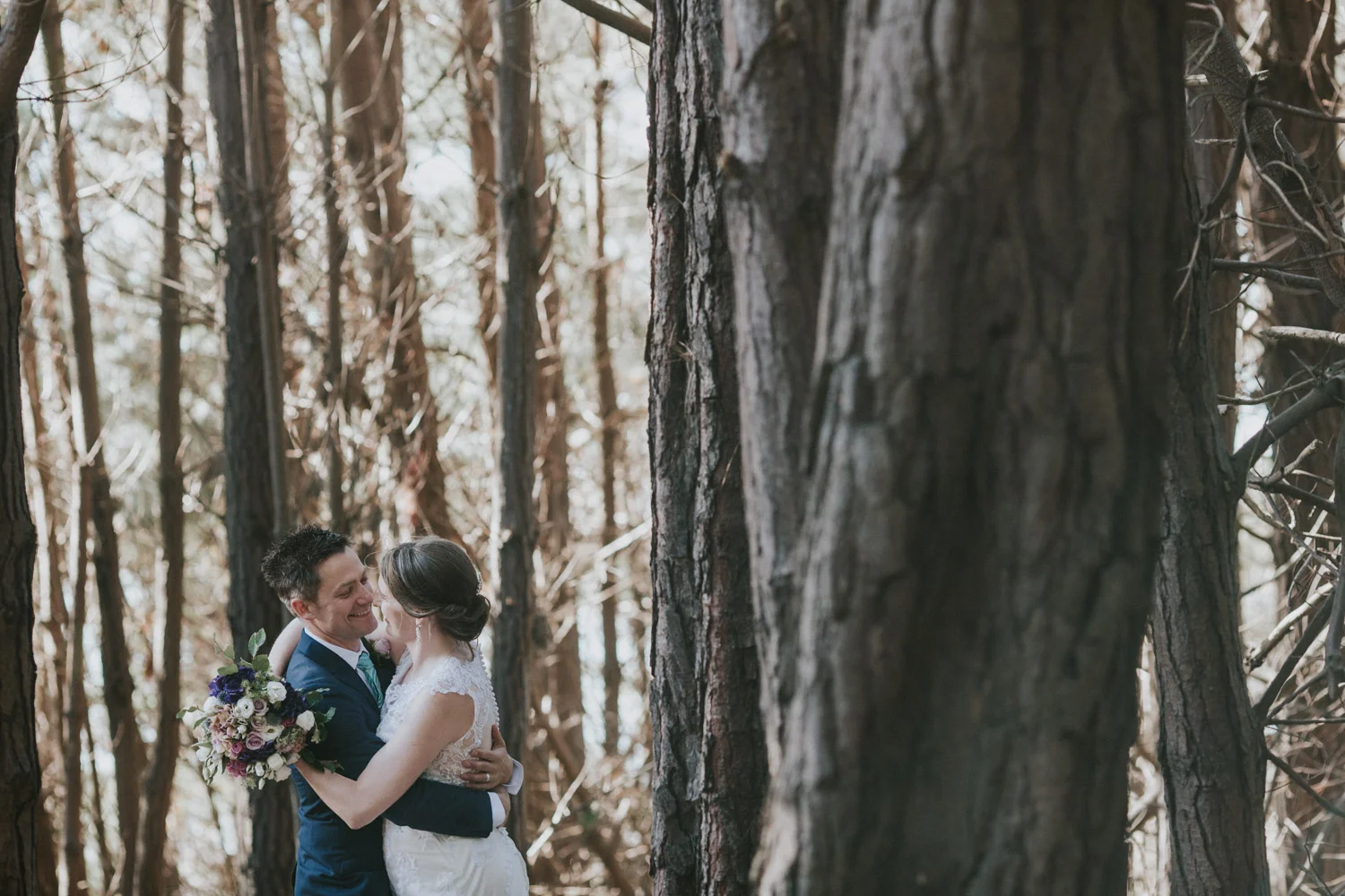 Bride and groom cuddling