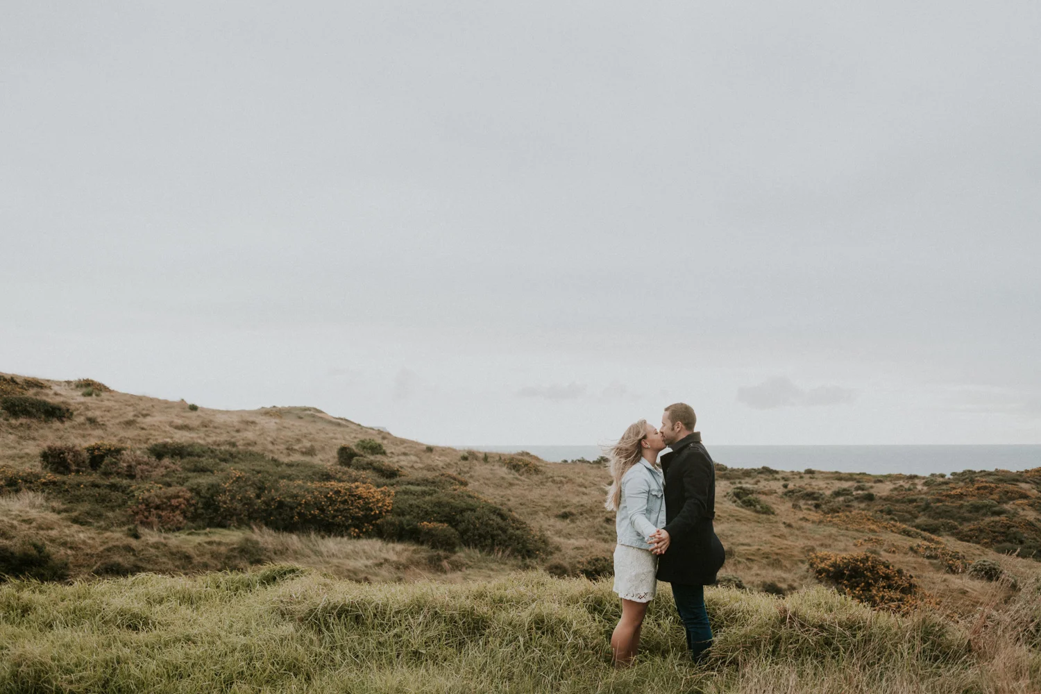 Couple holding hands and kissing