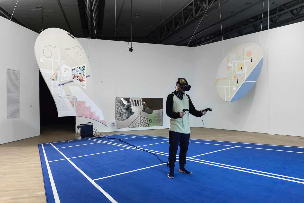 Florian Meisenberg, Of Defective Gods & Lucid Dreams (The Museum is Closed for Renovation), 2017, Installation: custom carpet, VR live-render-interactive-fluid-simulation, HTC Vive, 4 paintings (custom CNC-cut stretchers, oil paint, iridescent acrylic paint, and airbrush on canvas). Courtesy of the artist and Avlskarl Gallery, Copenhagen.