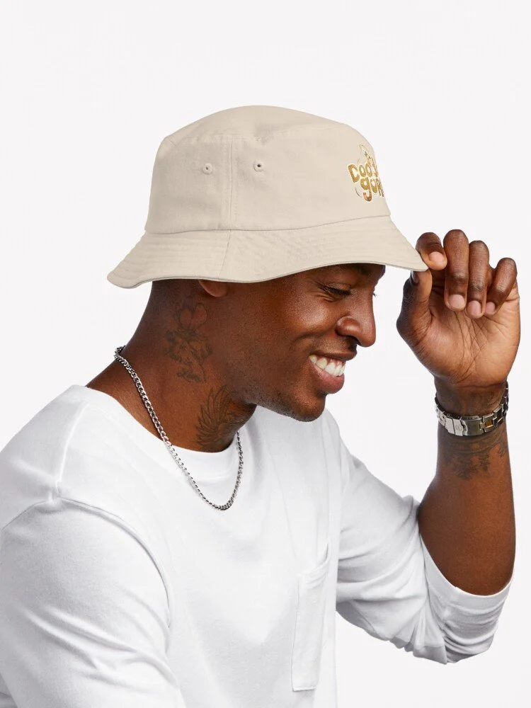 ssrco,bucket_hat,mens,e5d6c5_f62bbf65ee,side,tall_portrait,750x1000-bg,f8f8f8.jpeg