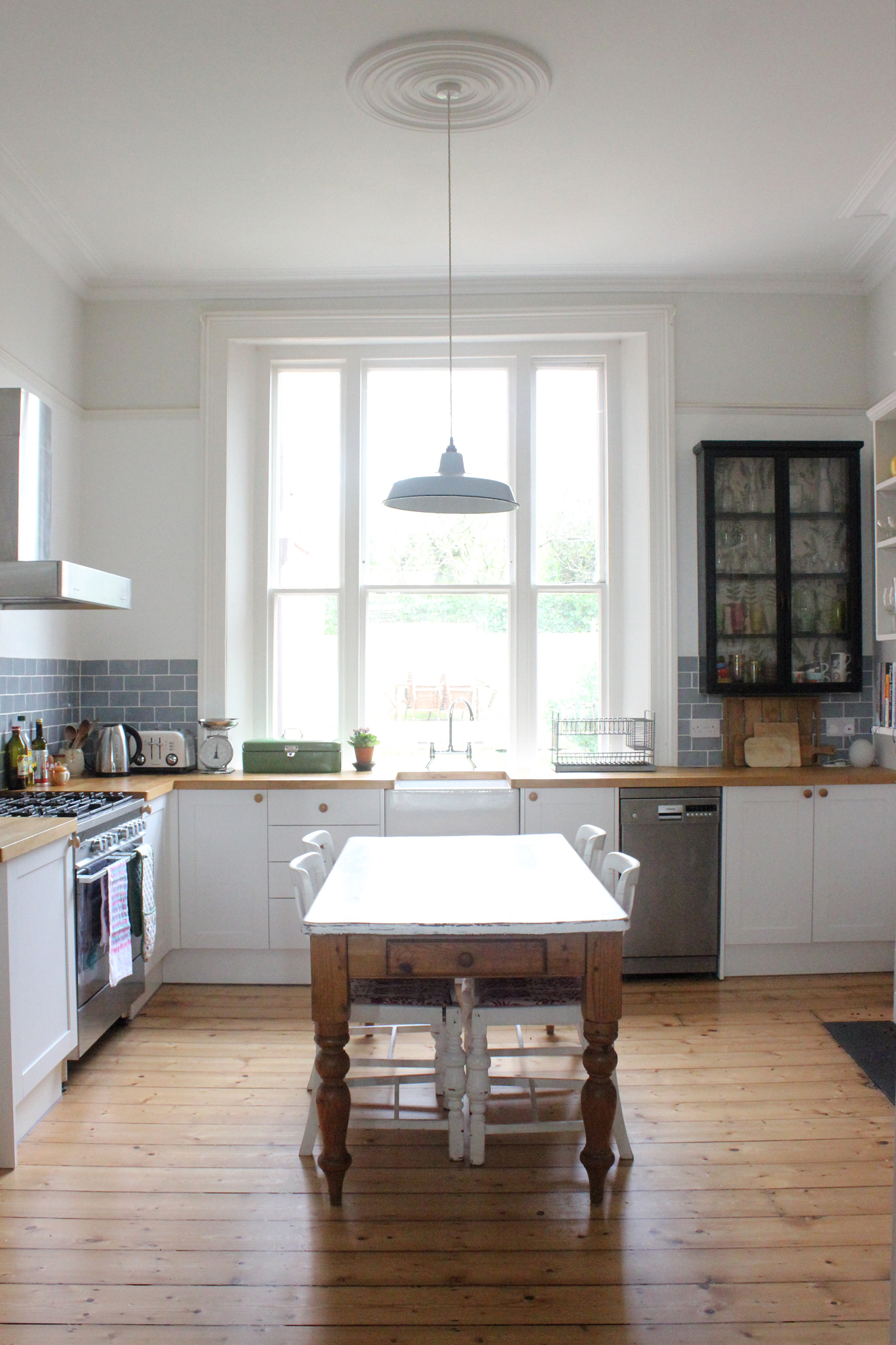 The Kitchen. Where do I begin? Maybe for a future blog post I'll do a 'before' of all the rooms. The kitchen is what I loved the most when we first viewed the house. It's a cliche, because it's true, that the kitchen is the heart of the house. Both Wojtek and I love cooking and entertaining and this was the perfect kitchen for us. The kitchen in every house we viewed was definitely a deal-breaker for us. It was essential that we could fit a big old kitchen table in the middle of it. The old kitchen units were horrible! They were big, bulky and blue, with glass tops that housed urban-looking graffiti art. The previous owners took the art with them and left us with two holes in the work tops. One glass top was smashed so we couldn't use half the counter. It was a very happy day when we finally had the kitchen done in 2015. (A week after Penelope was born!) Now we can say that the only thing left in the whole room from when we bought it is the cooker - which is very temperamental and will probably need replacing soon anyway!