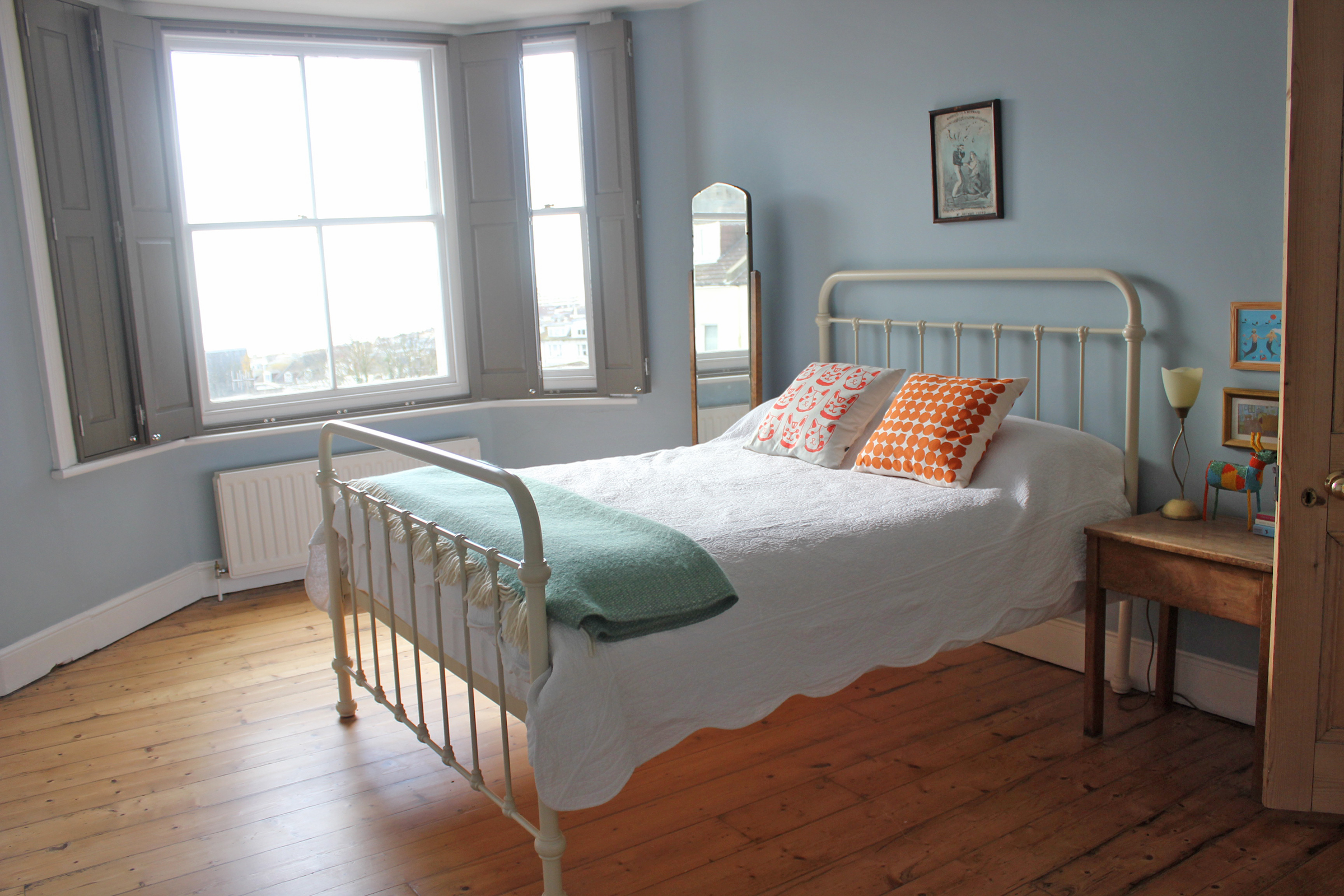 The Blue Bedroom. This room definitely has the best view in the house. Our friends love staying over in this room - it has a great seaside holiday feel. It overlooks the sea and Marine Court (a 1930's building made to look like a ship). The bed is from Feather & Black and the walls are painted Parma Gray from Farrow & Ball. 
