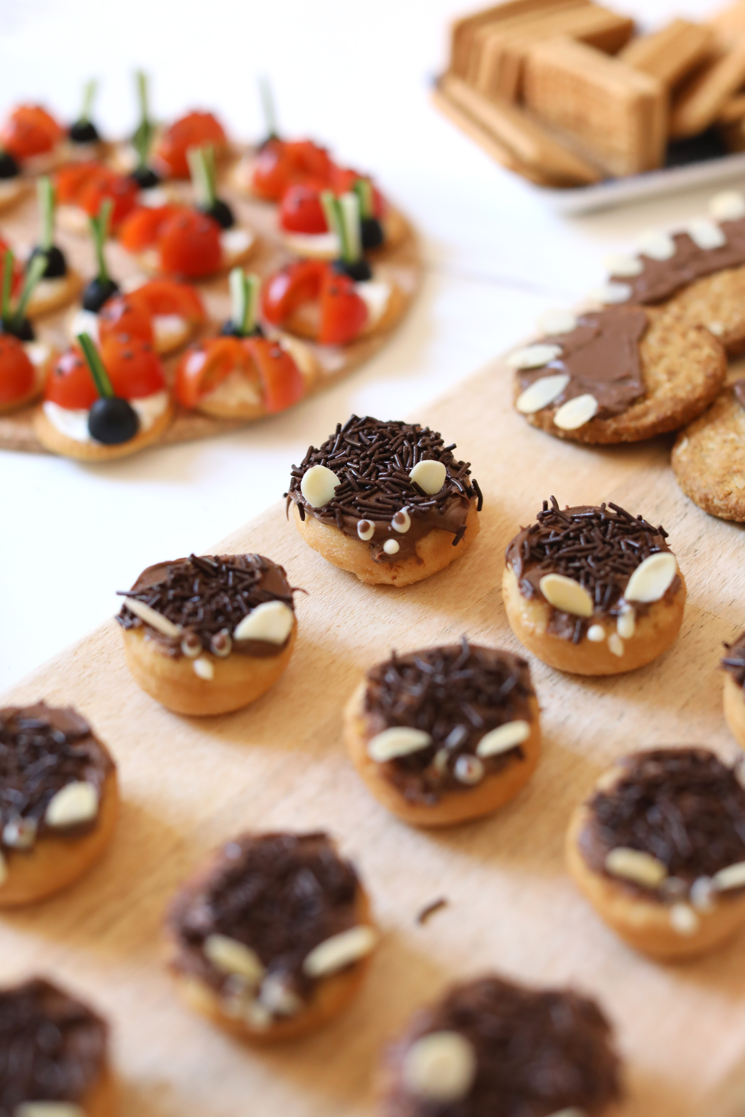 Hedgehogs made with mini doughnuts, chocolate spread, sprinkles and almonds. 