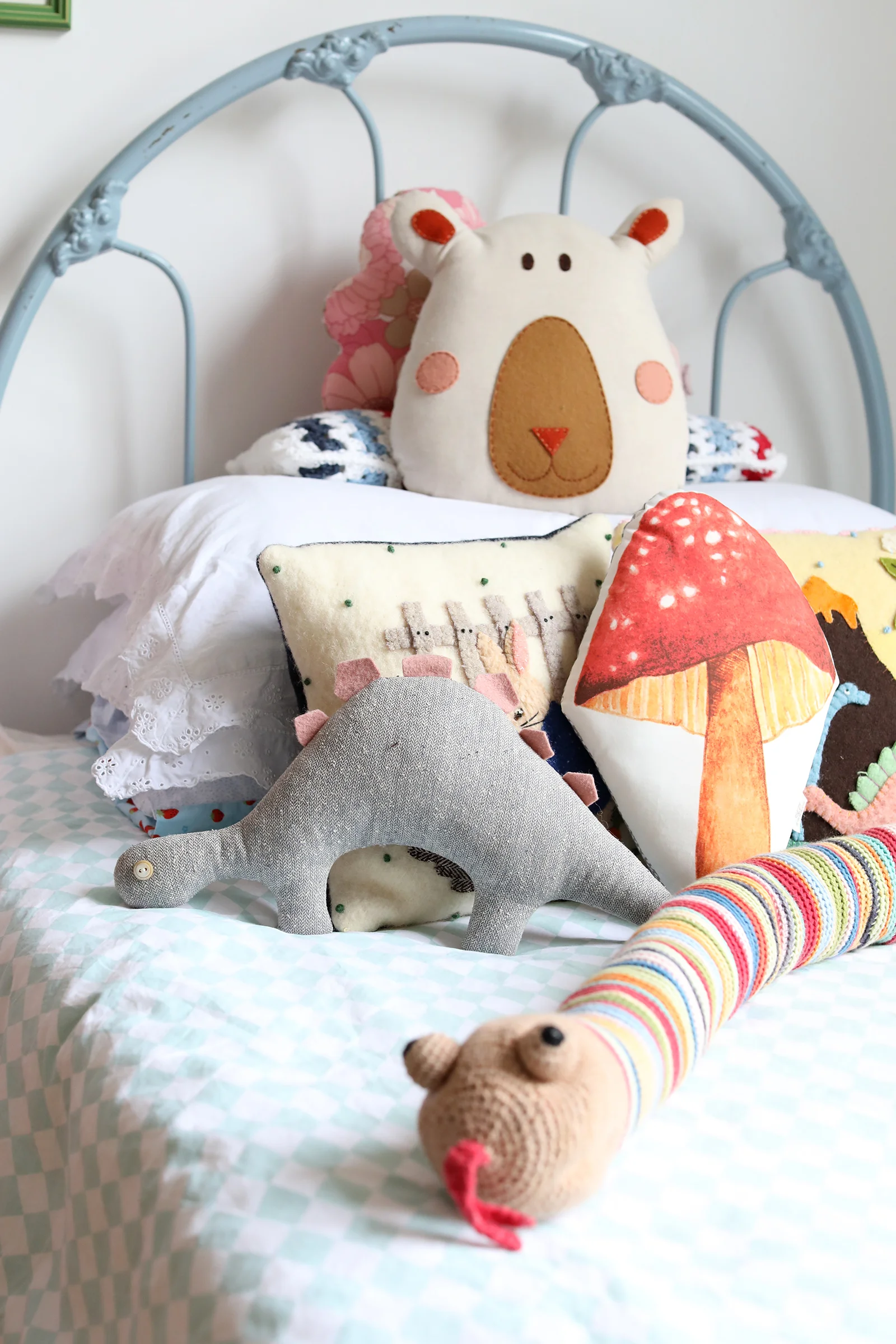 Dinosaur toys from Georgina Giles . The beautiful blue vintage bed is from my friend, Bree.