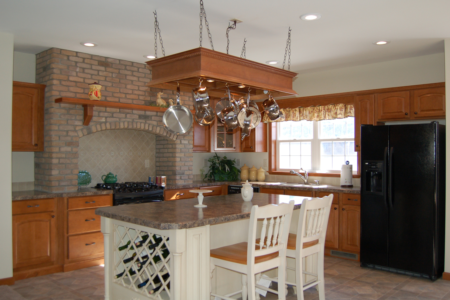 Aspen hand-laid brick around hearth, with a solid wood Spice Cherry mantle