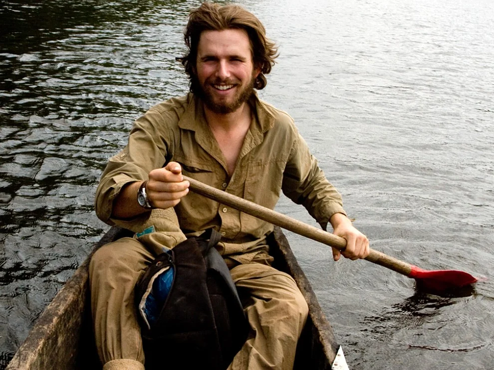 Trevor paddling a dugout canoe in Gabon