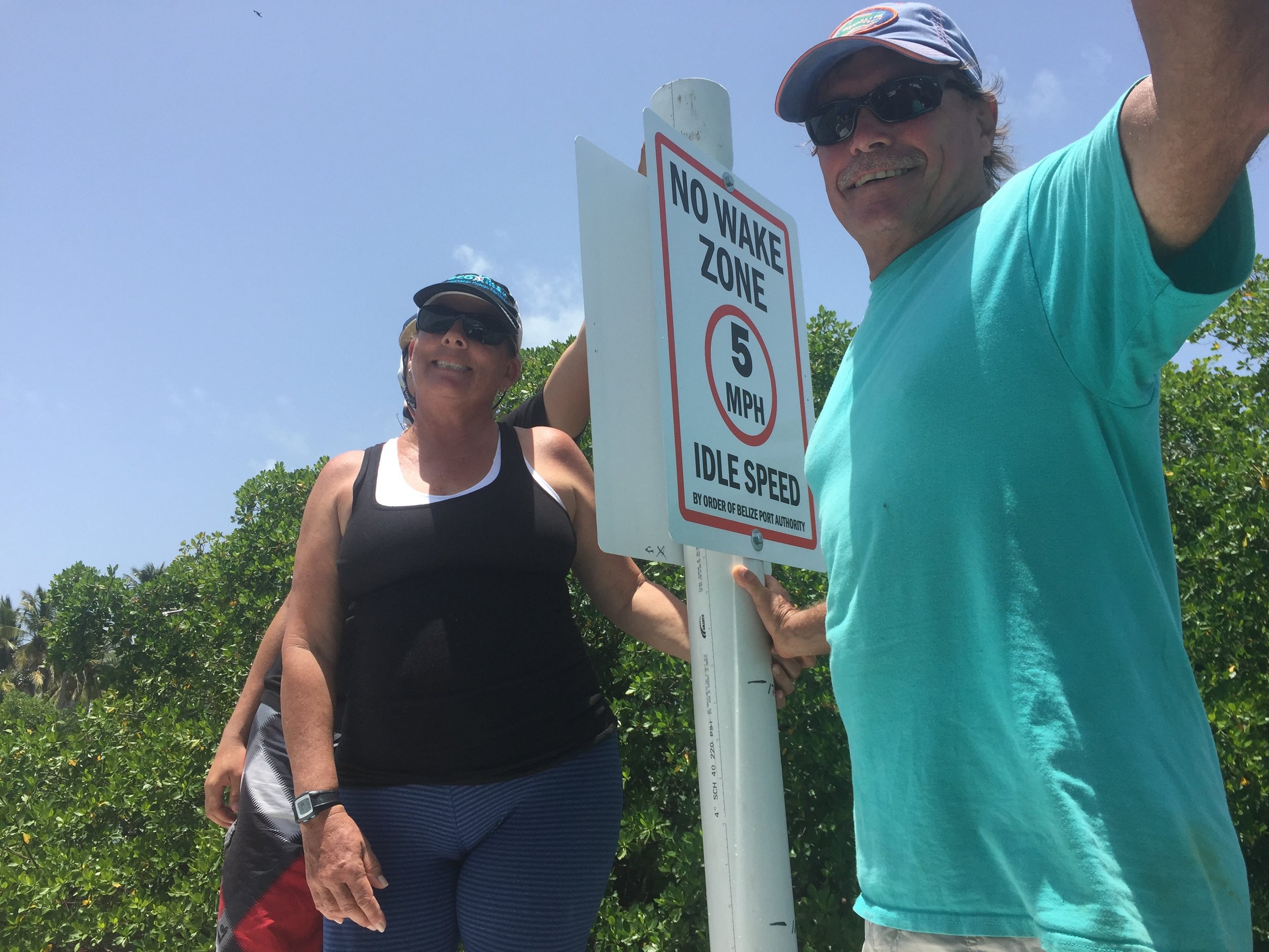 Linda & John Searle of EcoMar with the new speed limit signs that will reduce manatee injuries