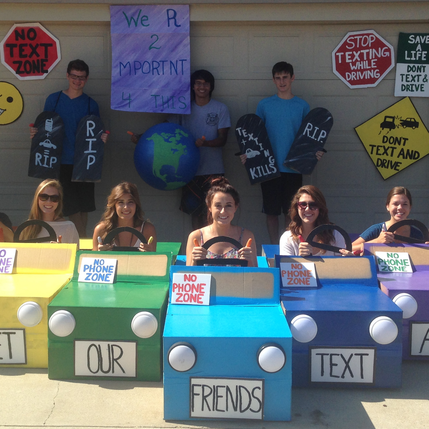 Kendra - -We actually made the cars out of cardboard boxes and used the left over cardboard to make the signs hanging in the background. We even painted one of our exercise balls to look like the word. I am very lucky to have the friends i .jpg