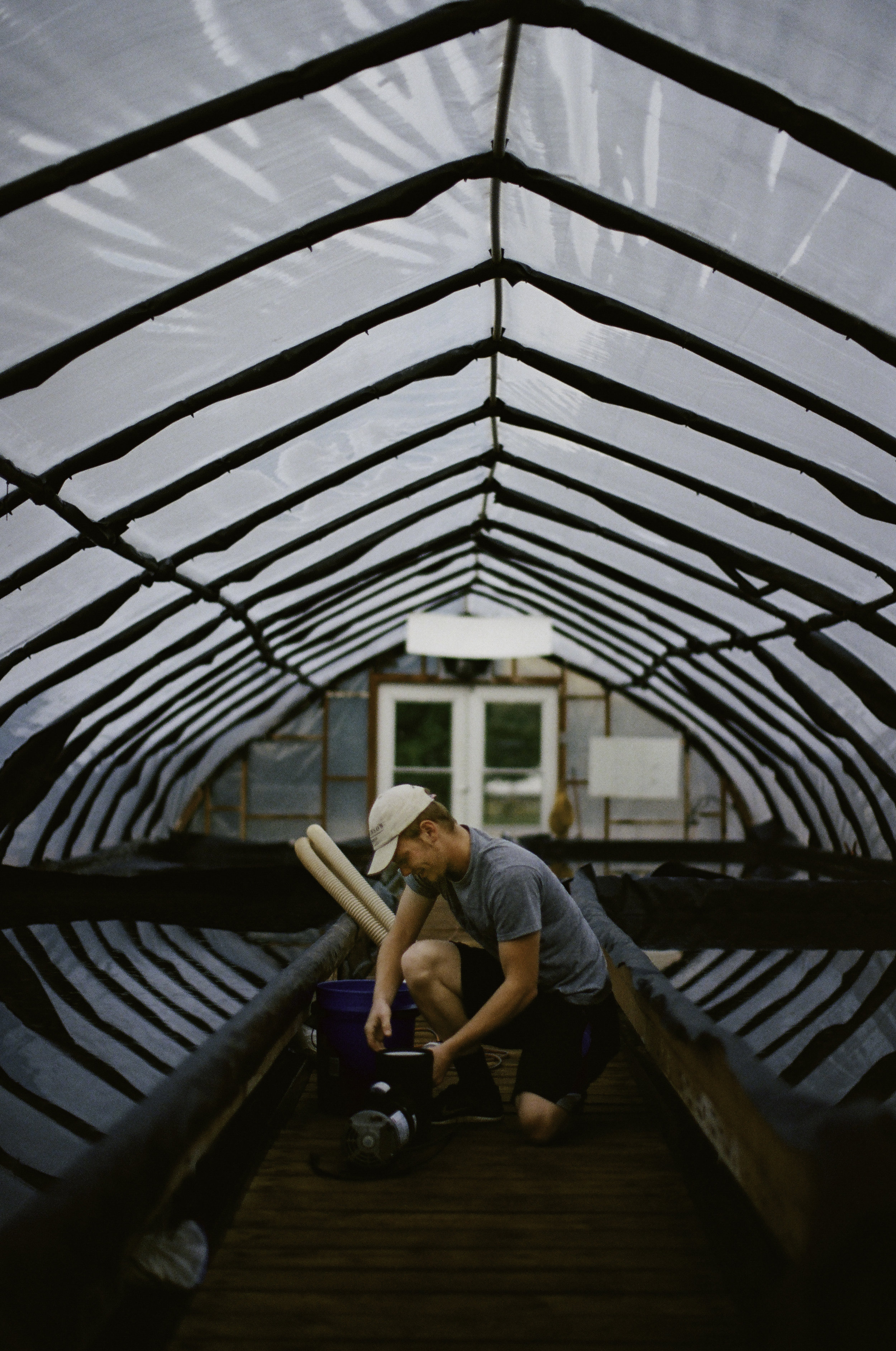  Sam Stone preparing the pump that transfers the brine from the initial sunhouse to the Grainary where the crystallization takes place. "It can go from from being pumped out of the ground to someone’s dinner table in just a few weeks." 